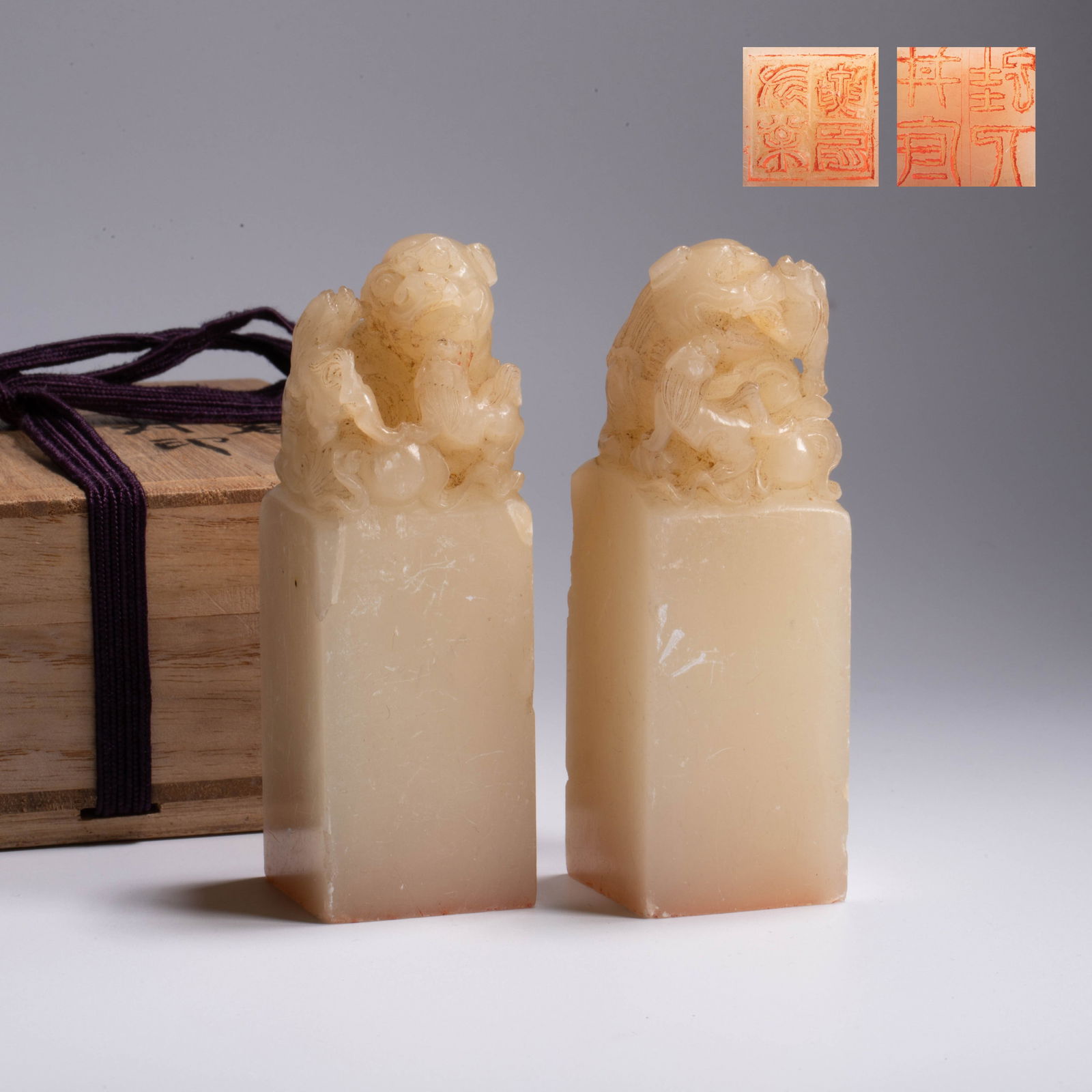 Pair of White Hibiscus Stone Seals with Dragon Finials: Pair of White Hibiscus Stone Seals with Dragon Finials