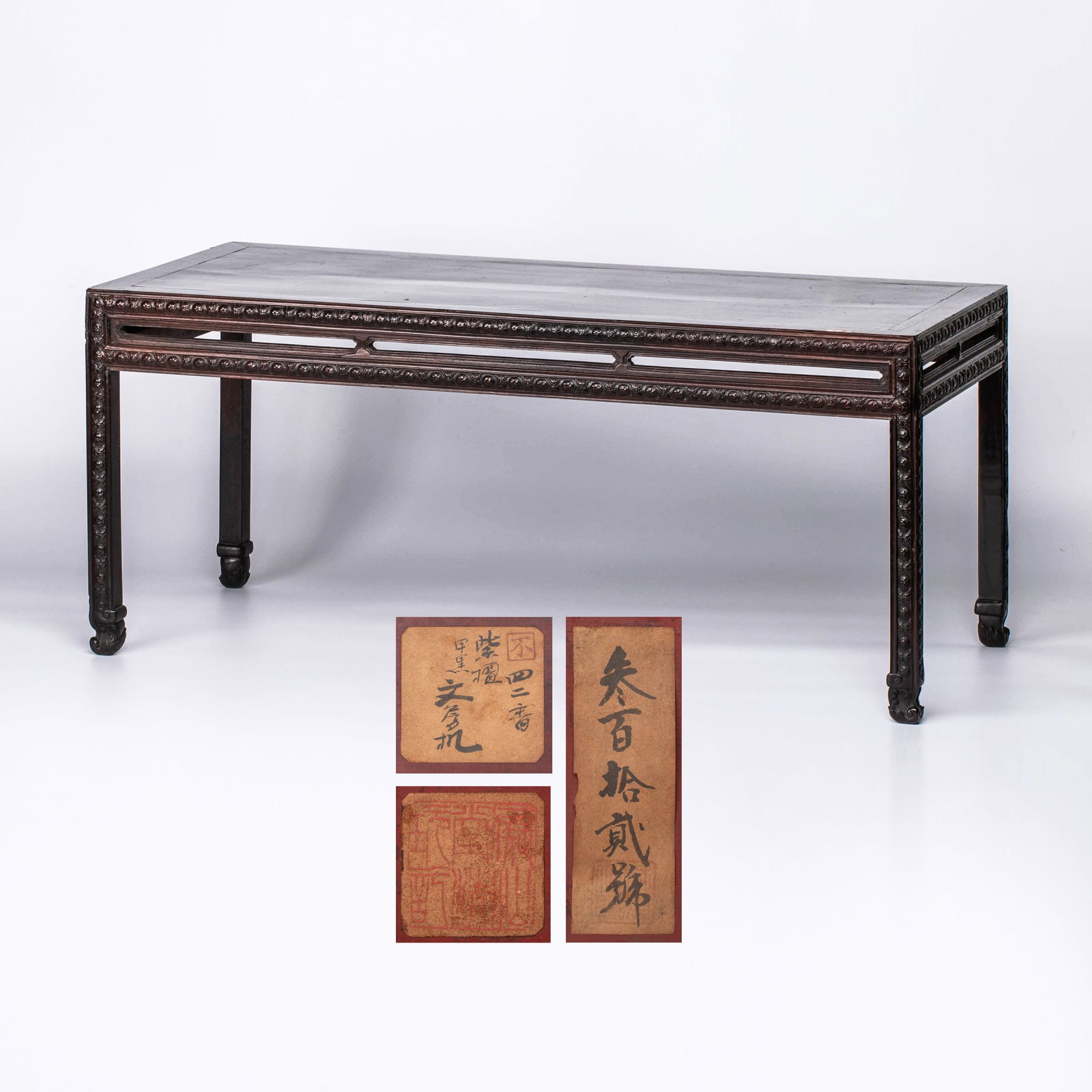 Qing Dynasty zitan (rosewood) table: Qing Dynasty zitan (rosewood) tablePaper labels and collector’s seal labels are affixed beneath the table, inscribed “No. 312” and “No. 42: zitan scholar’s desk.” One red seal