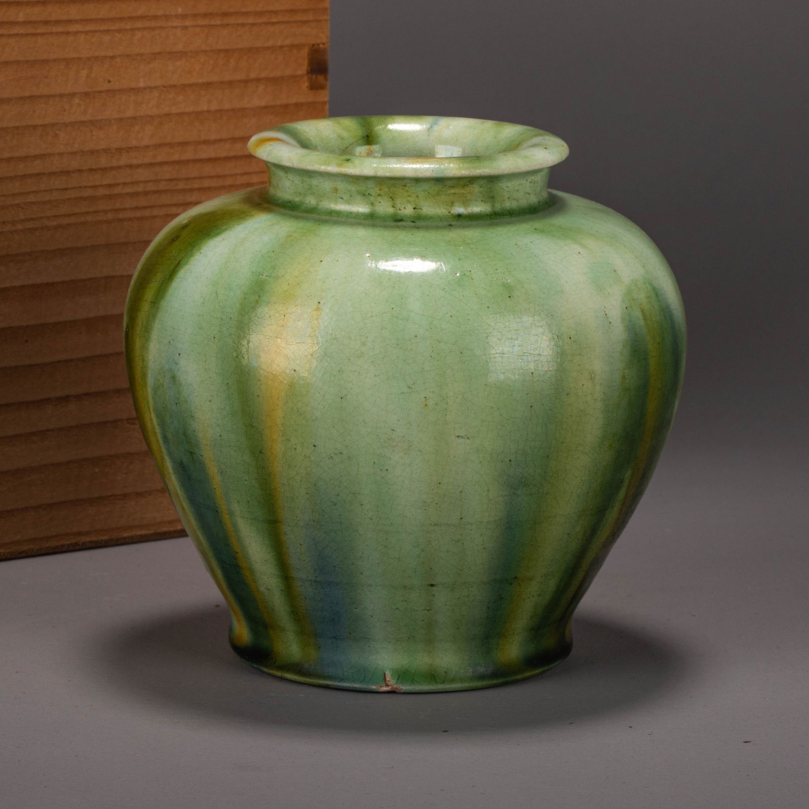 Tang Dynasty sancai ‘Wannian’ jar: Tang Dynasty sancai ‘Wannian’ jar – Full, rounded form with outward-flaring mouth and short neck; green glaze accented with flowing yellow and white; exposed off-white base with stilt marks; ric