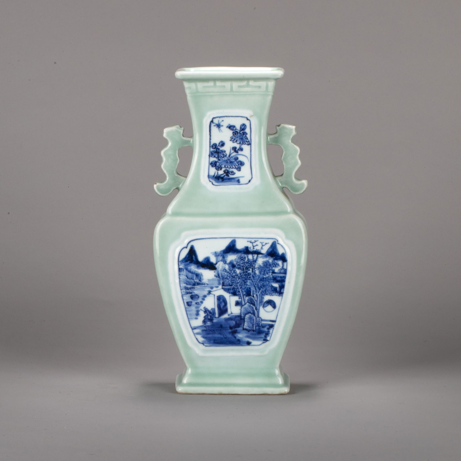 Qianlong Reign, Qing Dynasty Underglaze-blue Landscape and Figure Double-handled Vase with Reserved: Qianlong Reign, Qing Dynasty Underglaze-blue Landscape and Figure Double-handled Vase with Reserved Panels on a Bean-green Ground