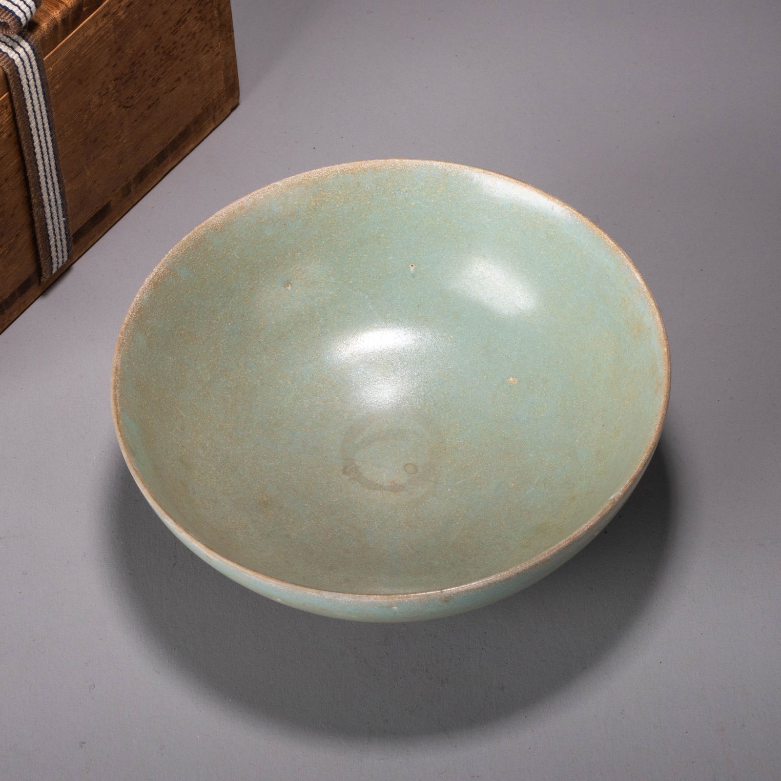 Ru ware bowl.: Ru ware bowl.- This bowl features a simple yet elegant form, with smooth, gracefully curved walls. The entire vessel is covered in a sky-blue glaze, lustrous and smooth as jade, with a soft, understat