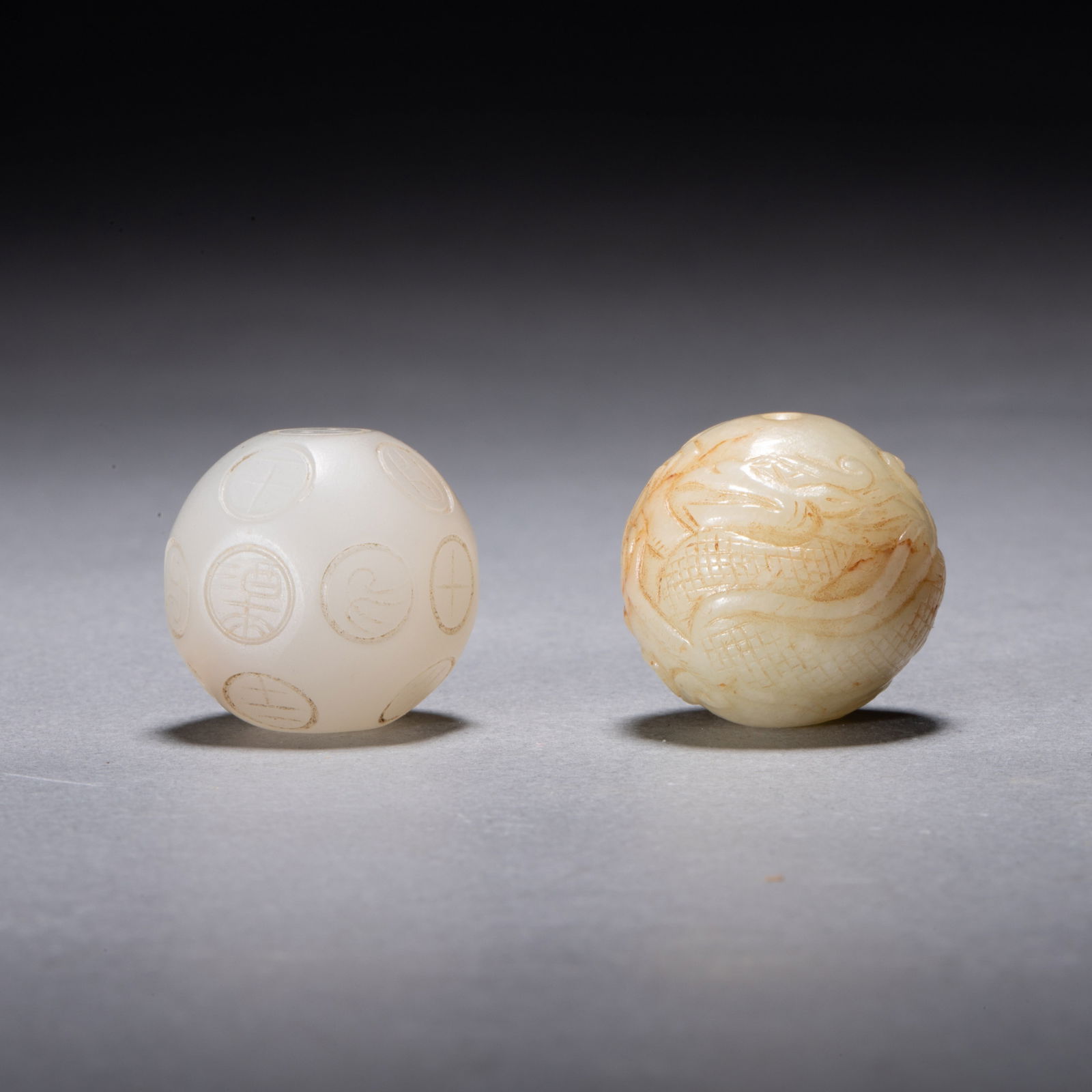 Two Tang Dynasty jade artifacts: dice and dragon pearl (1 of 7)