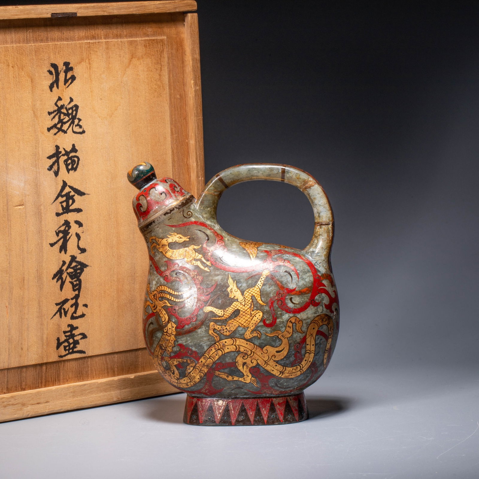 Northern Wei Dynasty gold-traced and painted jade pot: Northern Wei Dynasty gold-traced and painted jade - This vessel is a rare treasure from the Northern Wei Dynasty. Crafted from warm and lustrous jade, the pot has a flattened oval shape with a full, r