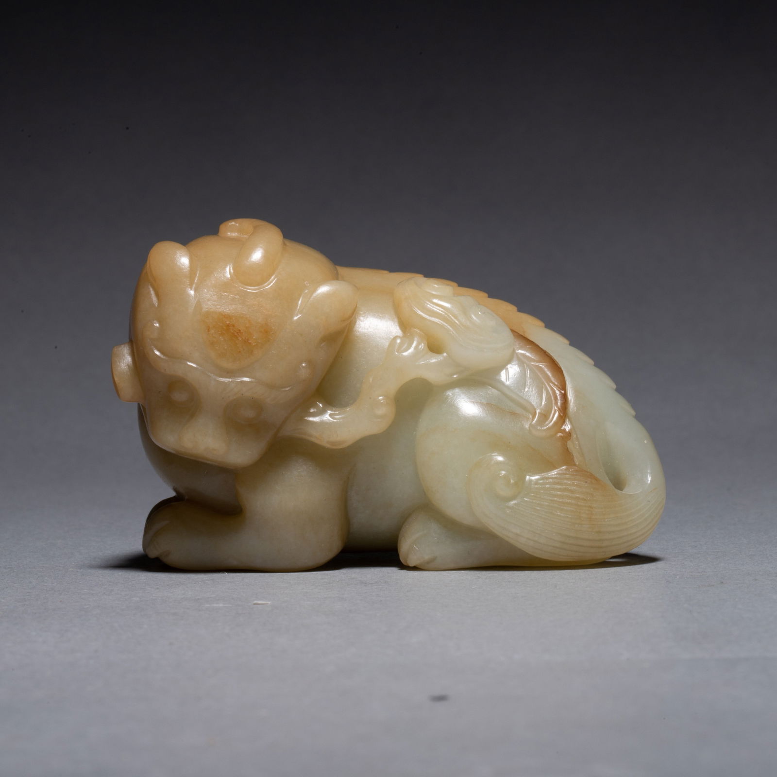 Ming Dynasty Hetian jade xiezhi (mythical beast) with skin: Ming Dynasty Hetian jade xiezhi (mythical beast) with skin