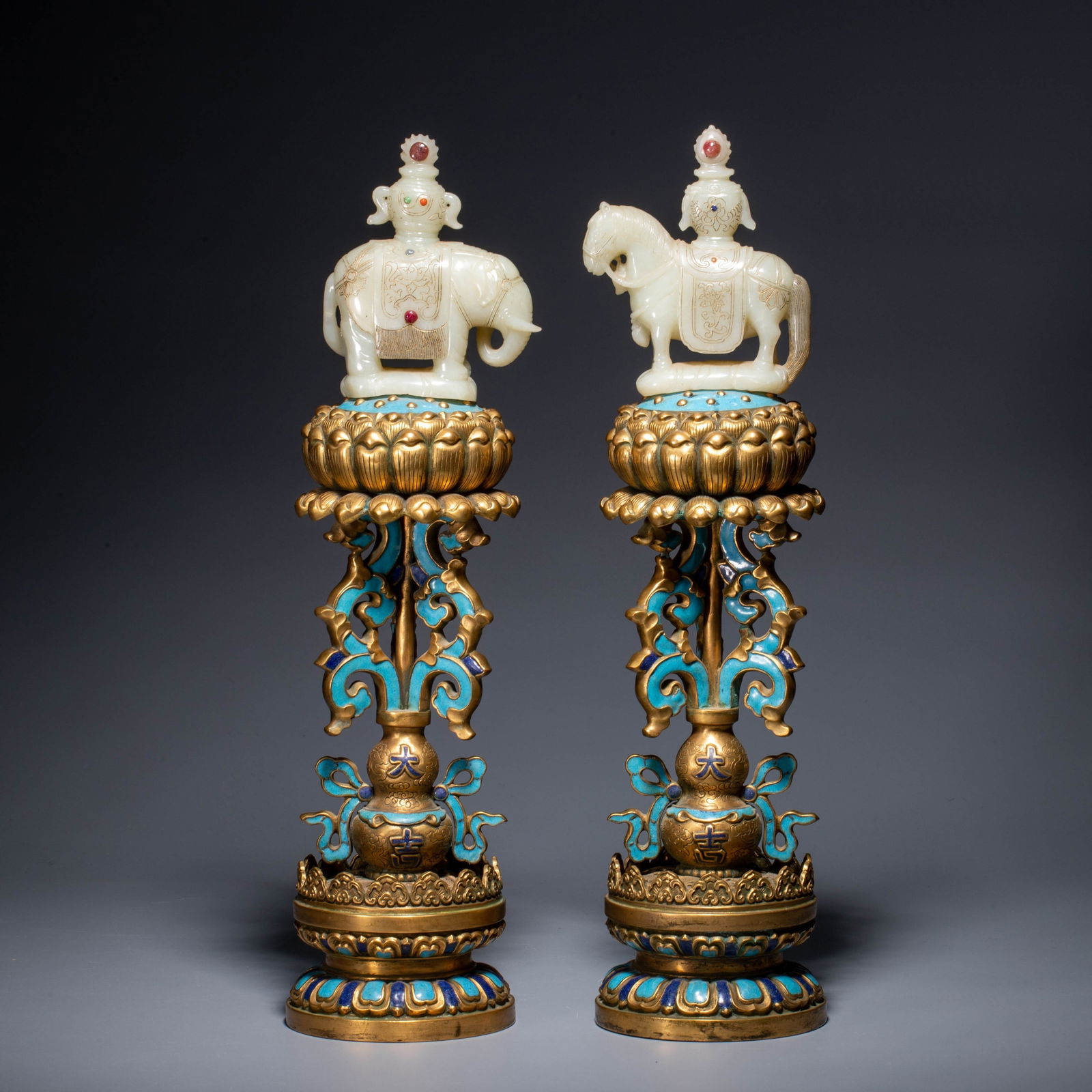 Qing dynasty gilt copper and enamel: Qing dynasty gilt copper and enamelThis pair of Qing Dynasty court decorative objects is crafted from fine copper and fully gilded. One piece features a white jade carving of an auspicious elephant as