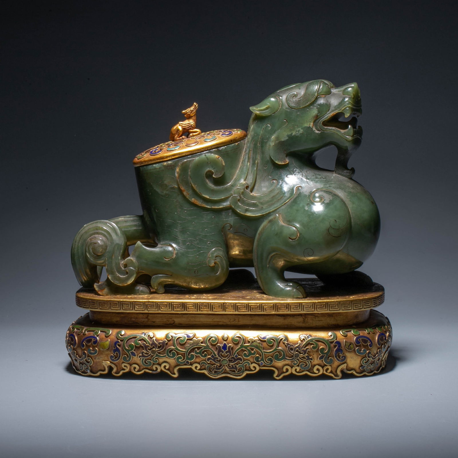 Qing Dynasty A sapphire ward off evil spirits with silver and gilt lid and base: Qing Dynasty A sapphire ward off evil spirits with silver and gilt lid and base