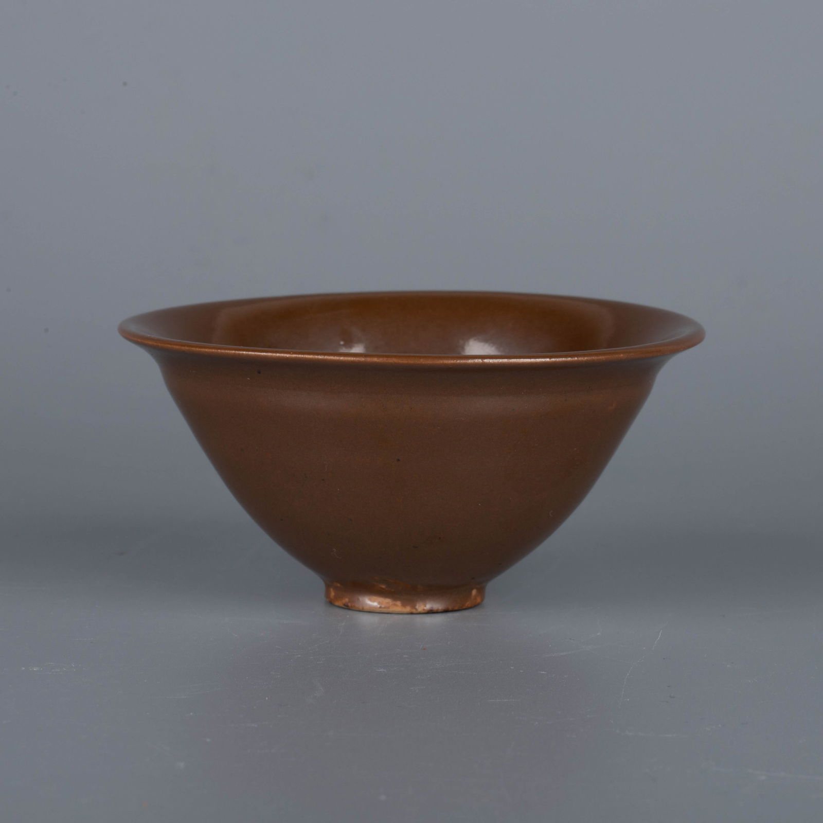 Song Dynasty Ding kiln persimmon glaze tea cup: Song Dynasty Ding kiln persimmon glaze tea cup