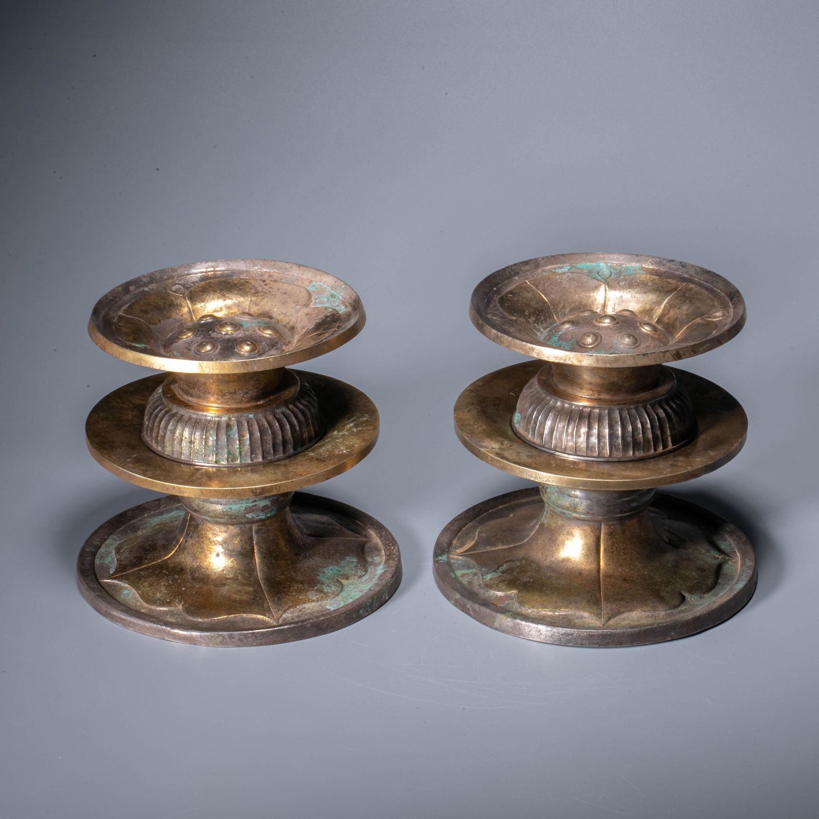 A pair of silver-gilt lotus-form altar stands, Ming dynasty: A pair of silver-gilt lotus-form altar stands, Ming dynasty