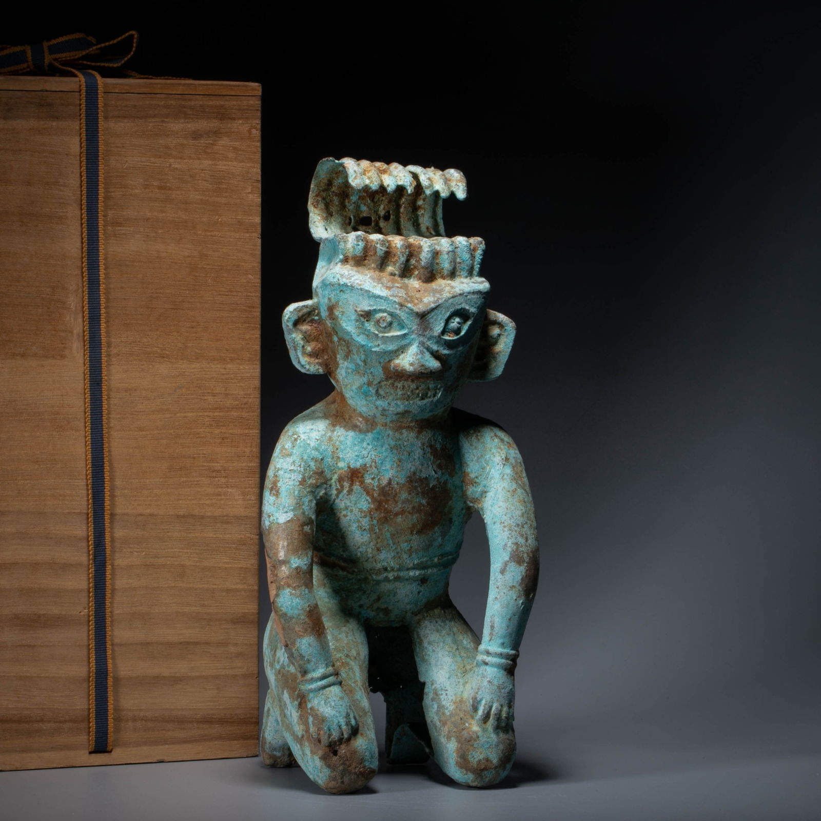 A bronze kneeling figure, Shang dynasty: A bronze kneeling figure, Shang dynasty