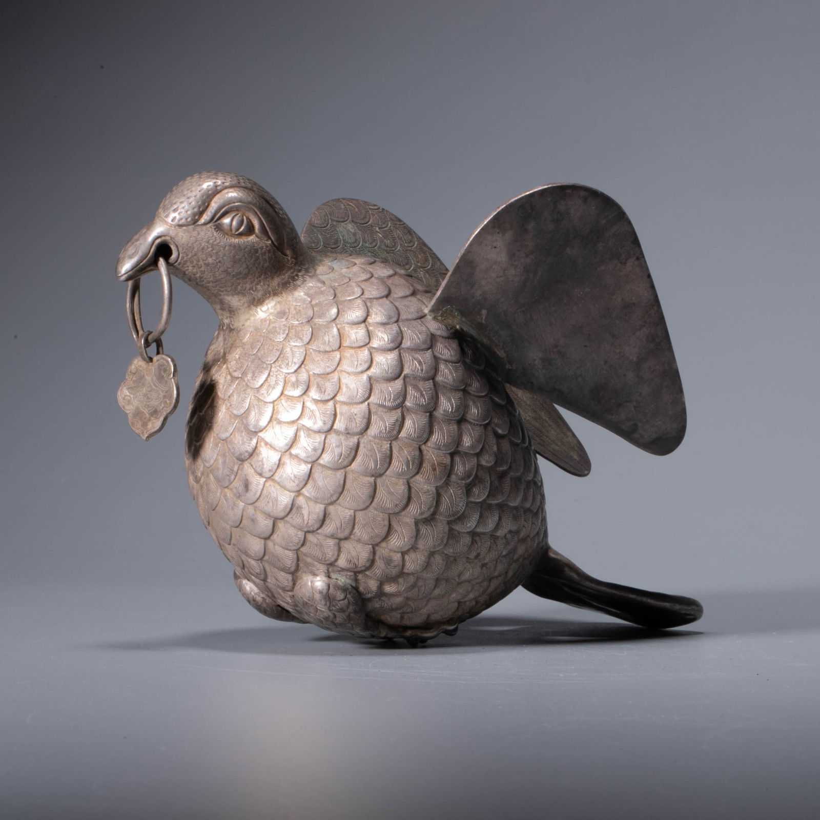 A silver bird-form vessel, Tang dynasty: A silver bird-form vessel, Tang dynasty