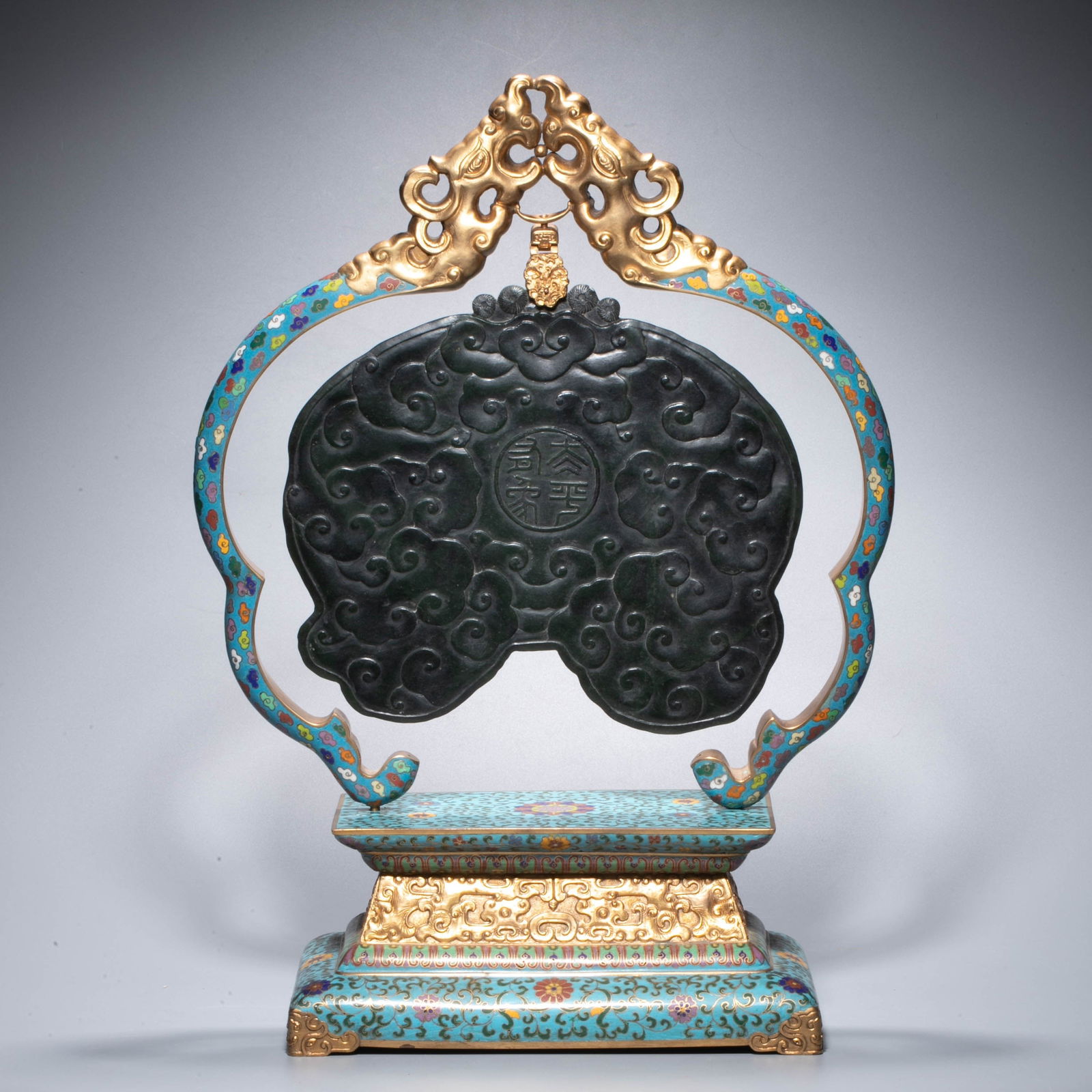 Gilt Cloisonné Enamel and Jasper ‘Taiping Youxiang’ (Elephant Bearing a Vase) Censer, Qing: This vessel was an important piece of palace furnishings in the Qing Dynasty and is shaped like a "xin" style vertical screen. the main body is made of jasper round sculpture "peace has an elephant":