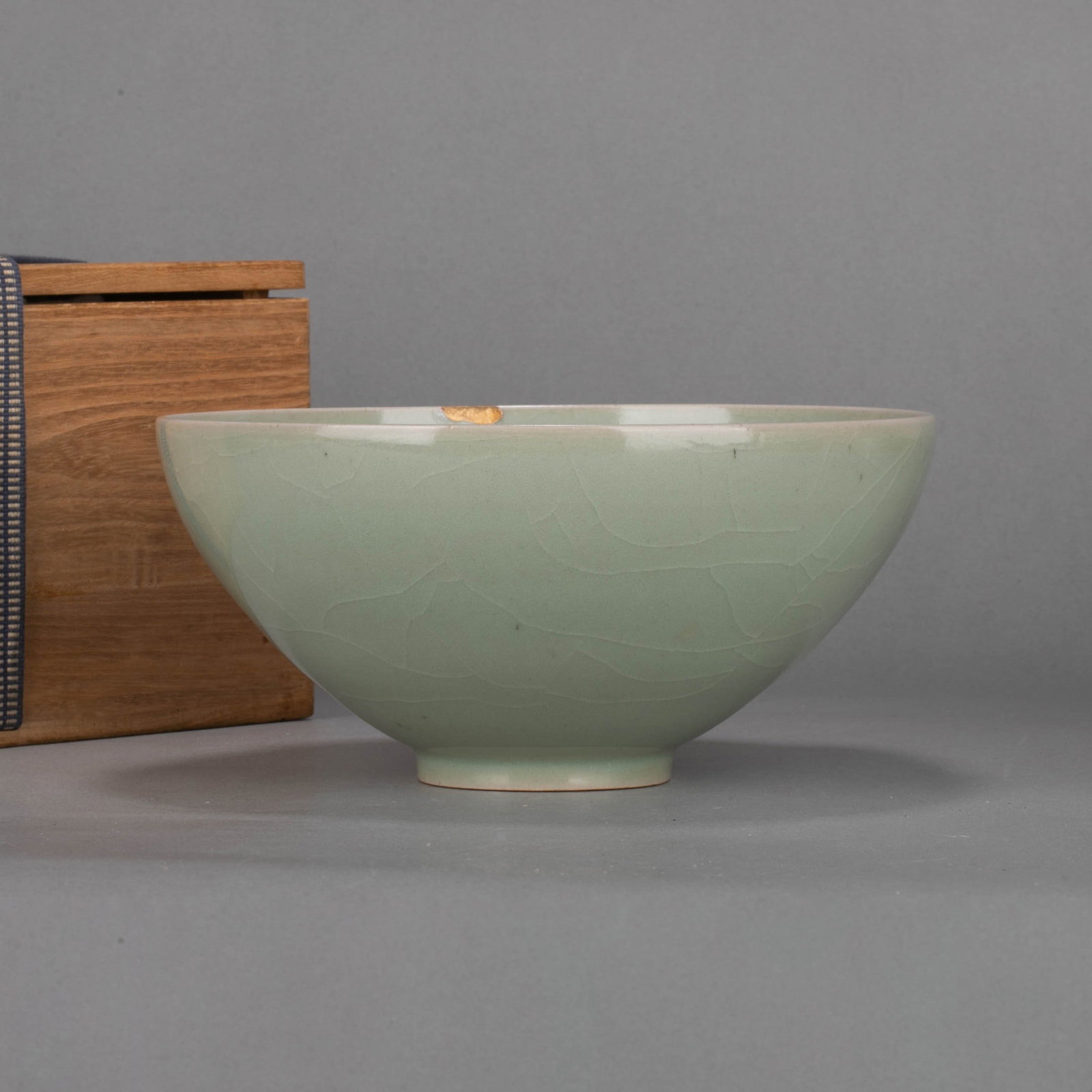 Song Dynasty Ru kiln bowl: This bowl from the Ru Kiln of the Song Dynasty has a narrow mouth, a deep belly, and a circle foot. The overall lines are round and smooth, dignified and simple, and the size is moderate. It is a very
