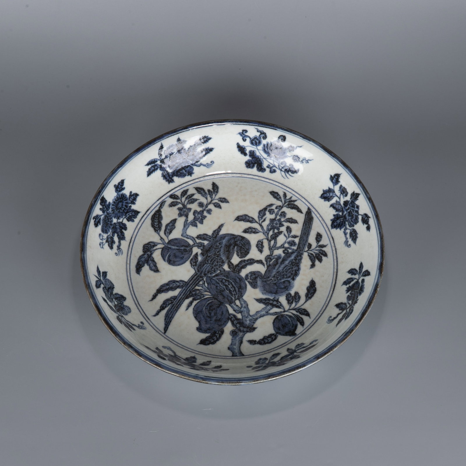 Ming sometsuke (blue and white underglaze) parrot holding a large plate with golden peach pattern (1 of 9)