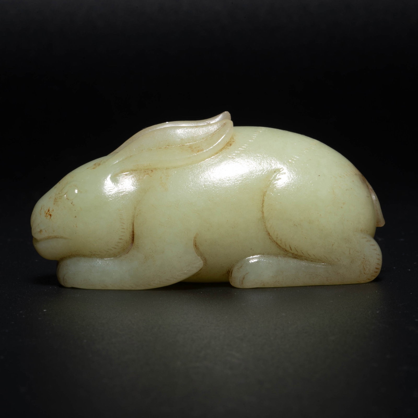 Hotan yellow jade lying rabbit handle piece: Hotan yellow jade lying rabbit handle piece