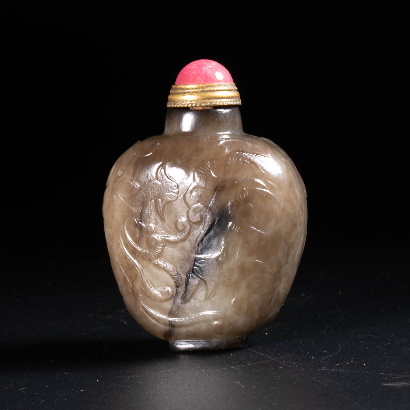 Hetian jade leather relief snuff bottle (1 of 5)