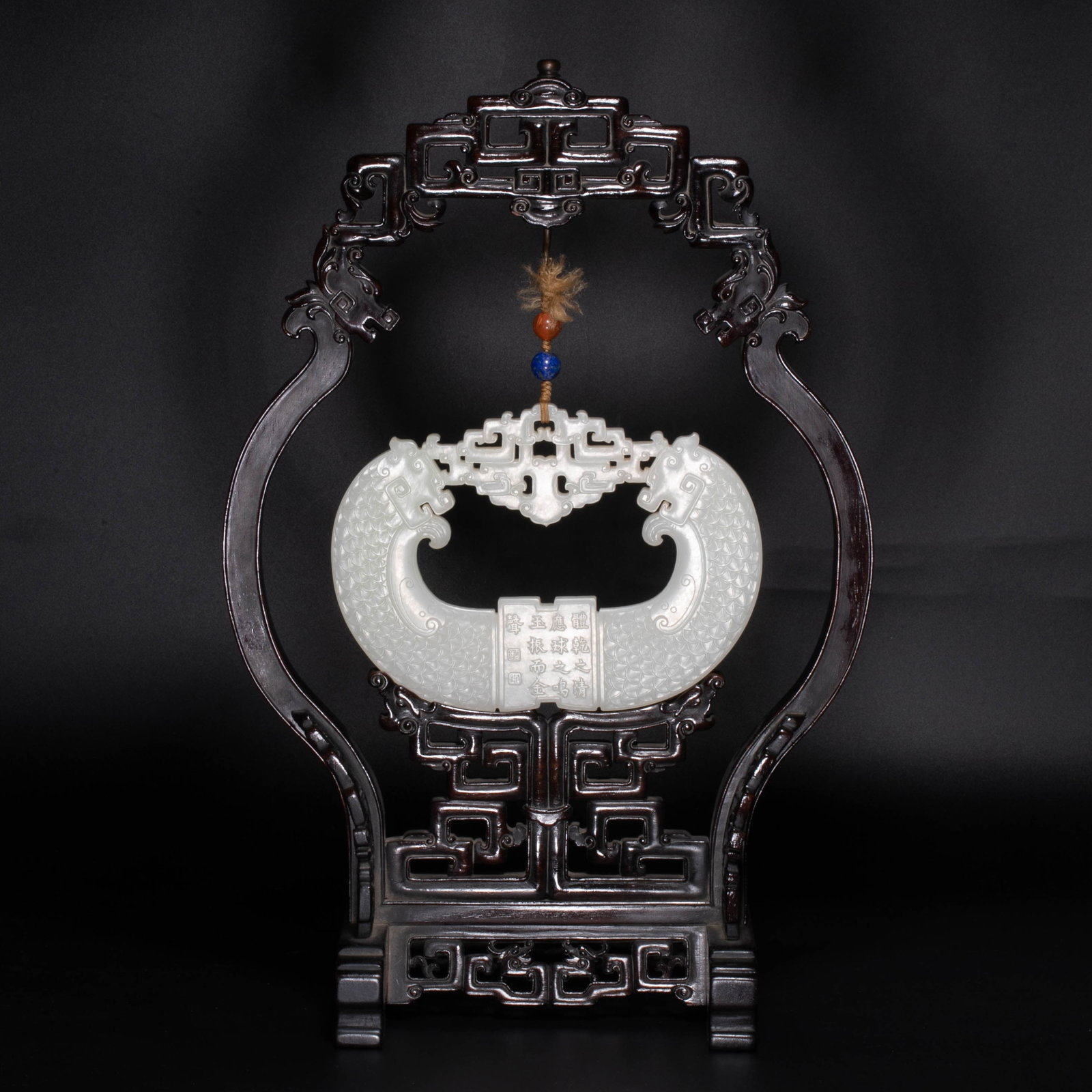 Qianlong Period, Qing Dynasty, White Jade Chime with Double Dragon Heads: This is a white jade double-dragon head jade chime from the Qianlong period of the Qing Dynasty. It is a model of antique jade carving for the Qing Dynasty palace.The jade chime is made of