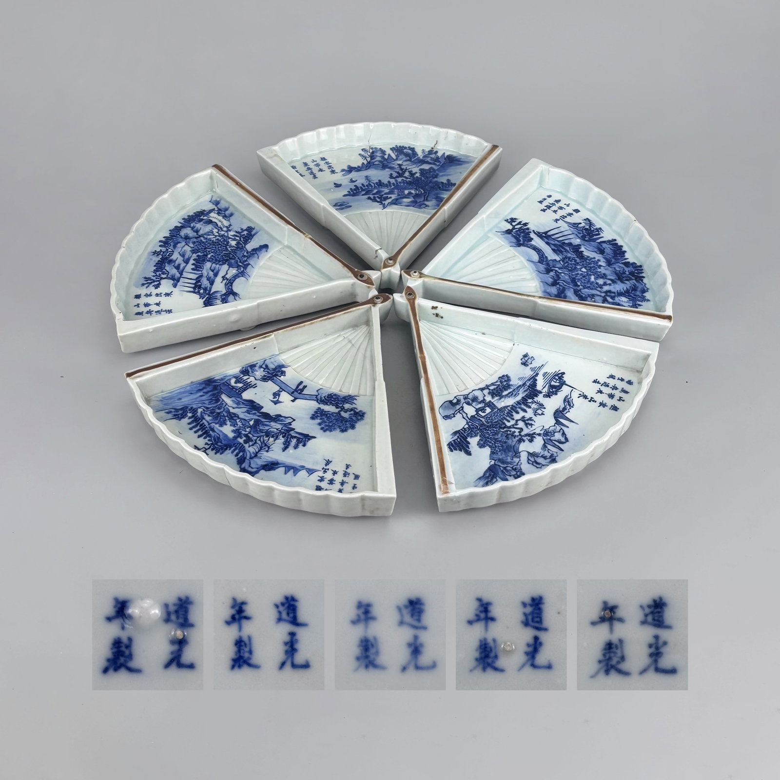 A set of Daoguang blue and white landscape poetry fan-shaped plates of the Qing Dynasty: A set of Daoguang blue and white landscape poetry fan-shaped plates of the Qing Dynasty