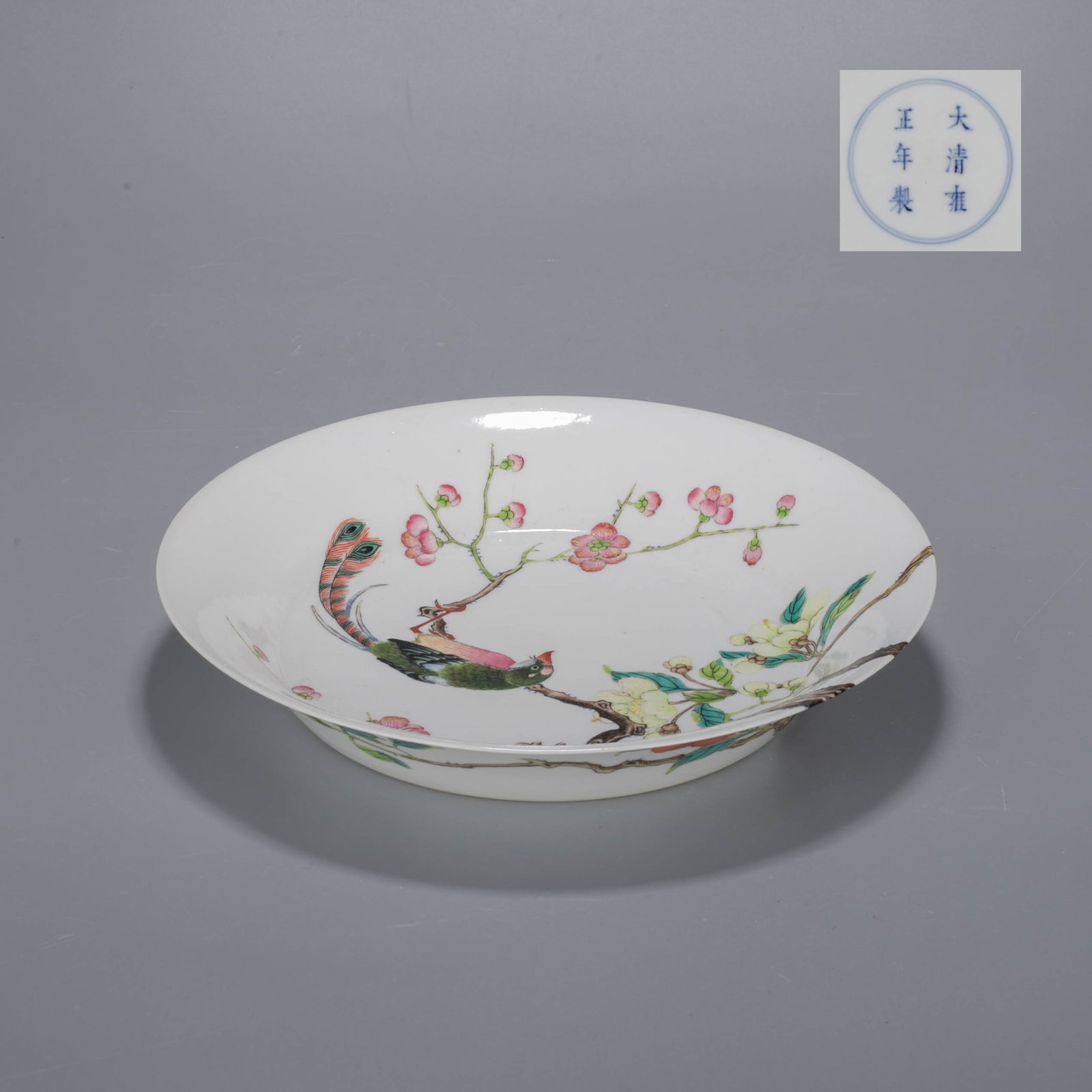Qing Dynasty Yongzheng Official Kiln, Pastel Bird Plate: This is a large pastel-colored longevity bird dish from the Yongzheng official kiln in the Qing Dynasty.The edge of the plate is outward, the belly is shallow, the feet are circled, the shape is regul