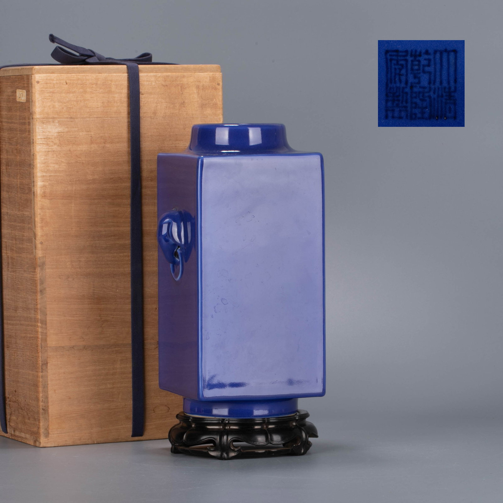 Qing Dynasty, Qianlong period, official kiln blue glaze elephant-head handles bottle: This is a Qianlong period of the Qing Dynasty, a jade-glazed elephant-ear-cong style vase (not with Bagua pattern).The shape of the vessel imitates an ancient jade cong, with a square column shape, a