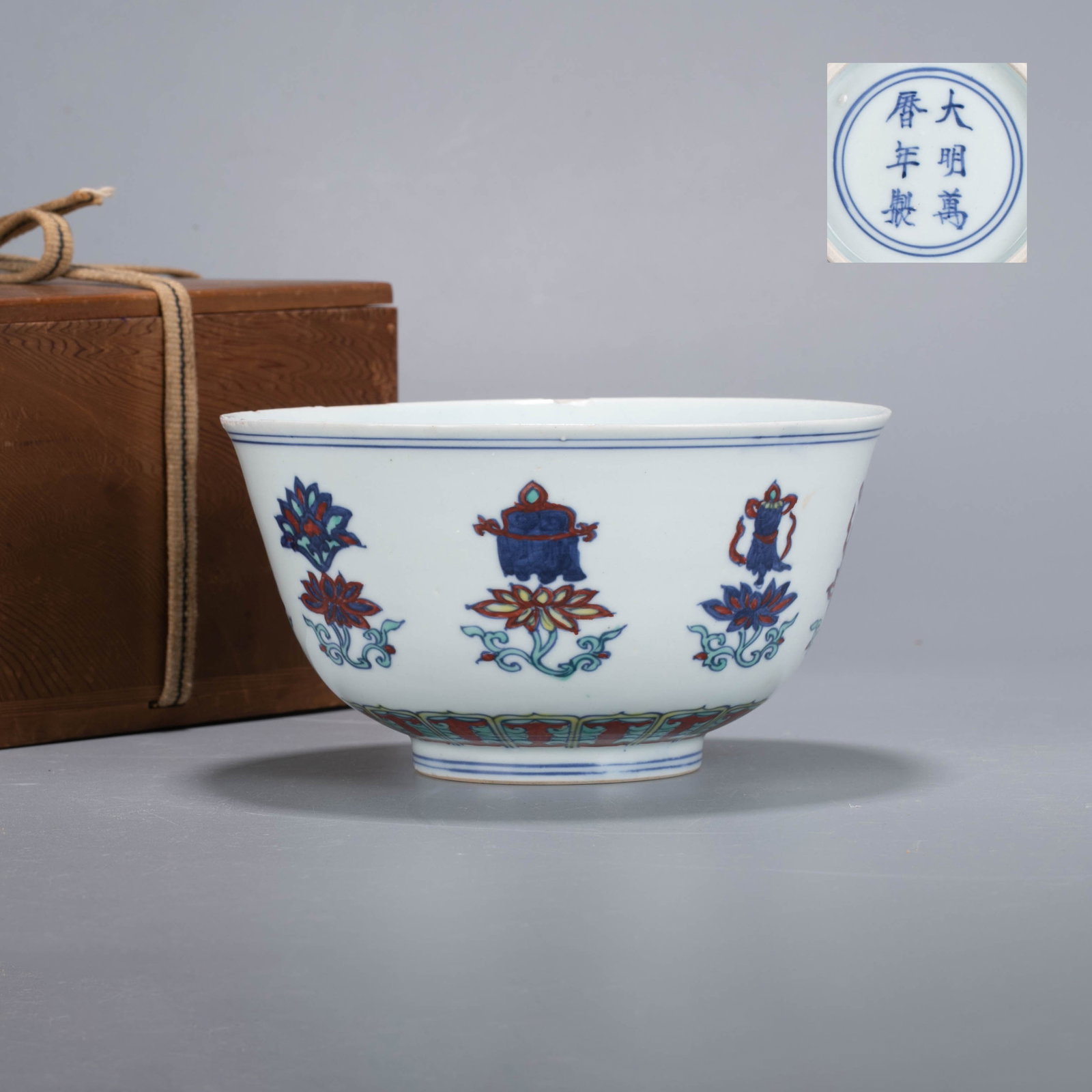 Wanli Ming Dynasty Five Colorful Eight Treasure Bowl: This is a blue and white bowl with colorful lotus and eight treasures pattern.The bowl has an open mouth, a deep arc belly, and a circle foot. Using blue and white multi-color technology, the outline