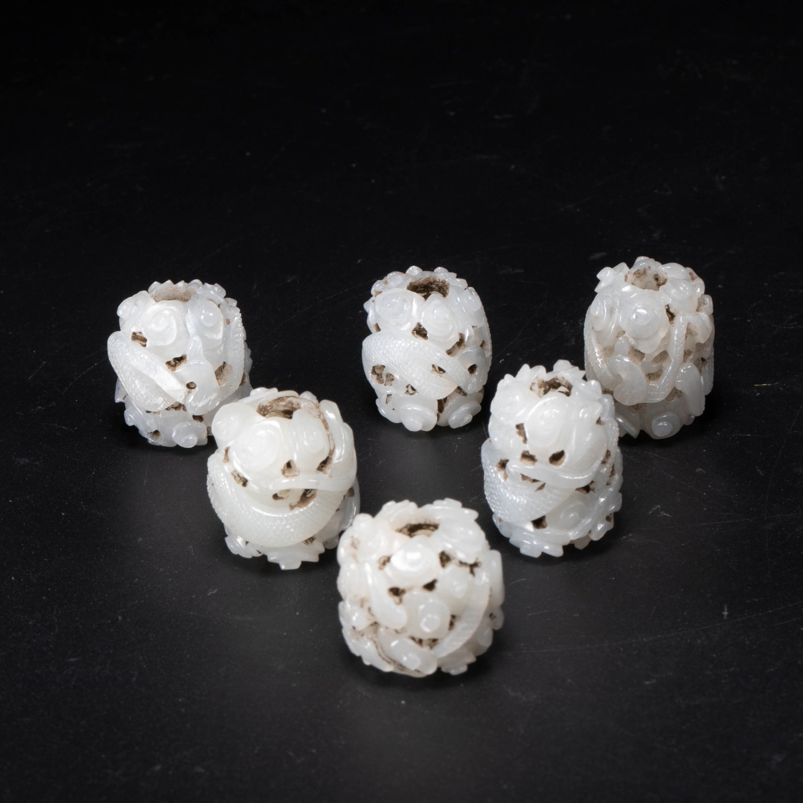 Ming Dynasty white jade dragon motif beads: Ming Dynasty white jade dragon motif beads