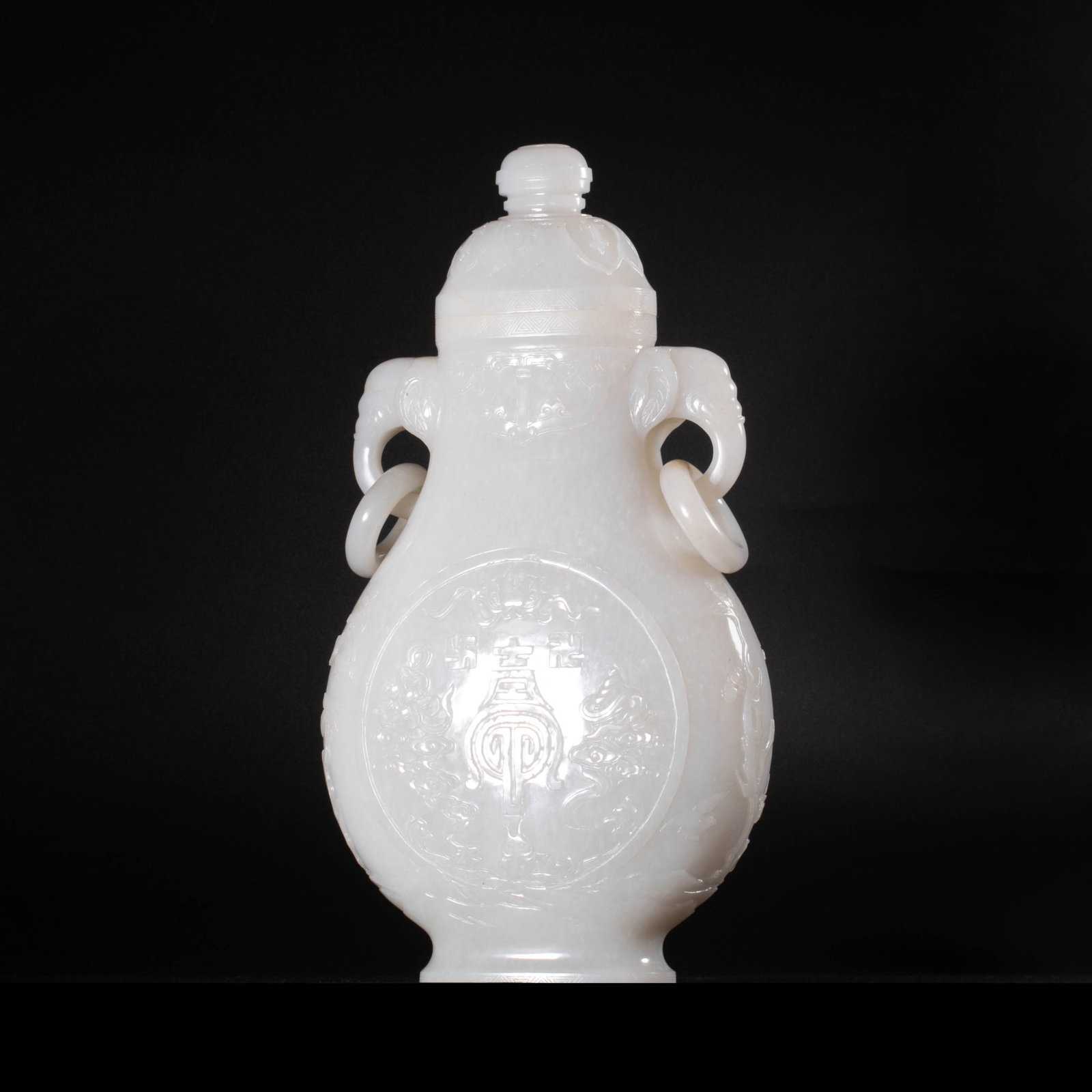 Qing Dynasty large white jade vase: This Qing style white jade is large vase and is cut from the whole material white jade. The texture is like gelatin, and the light and temperature are moist and translucent. The instrument is made in