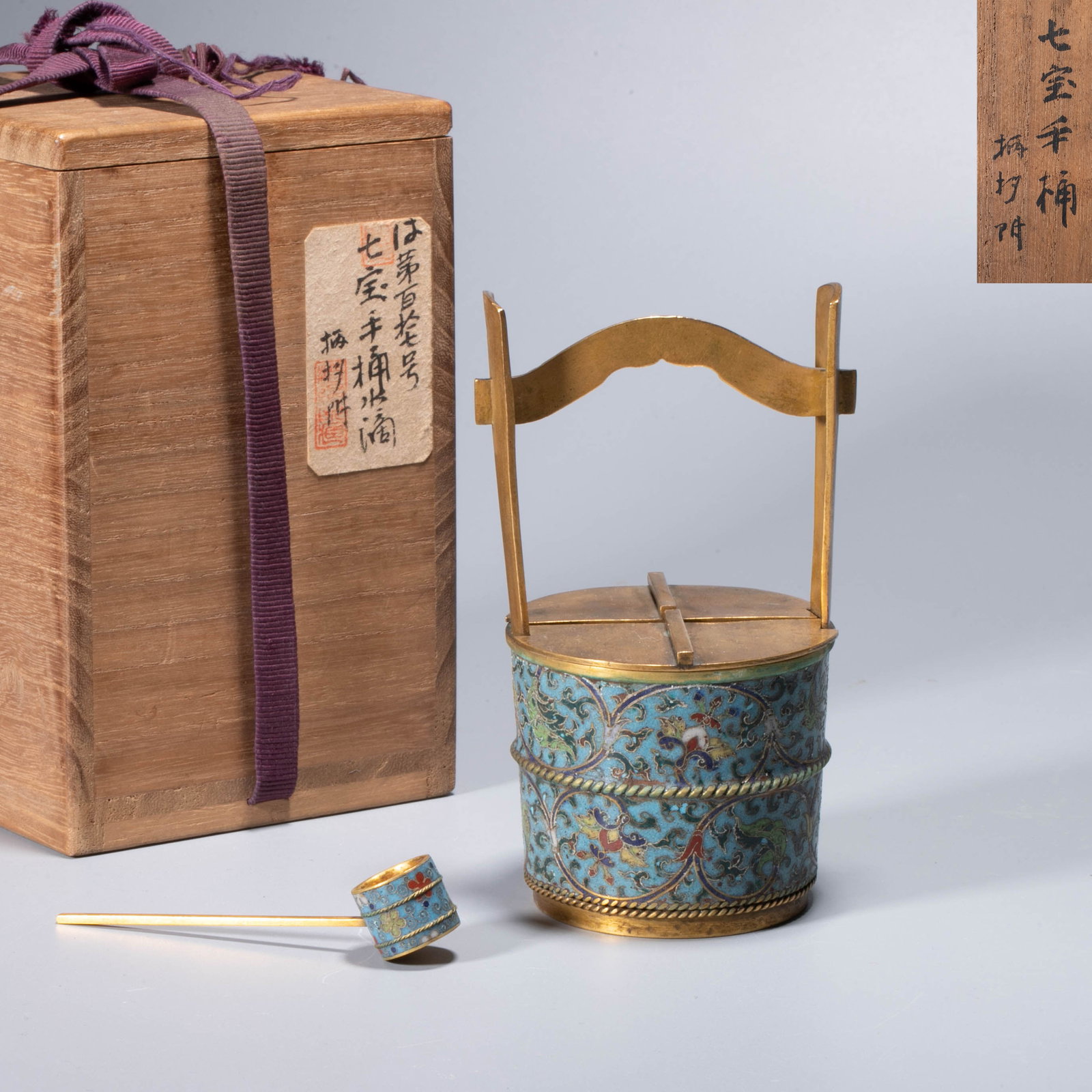 Bronze gilt cloisonne enamel Bucket type scholar's object Ornaments: This piece is a barrel-type scholar's object ornament, with bronze as the body gilt as the bone, and the whole body is decorated with cloisonne enamel with sky-blue ground branches floral decoration T