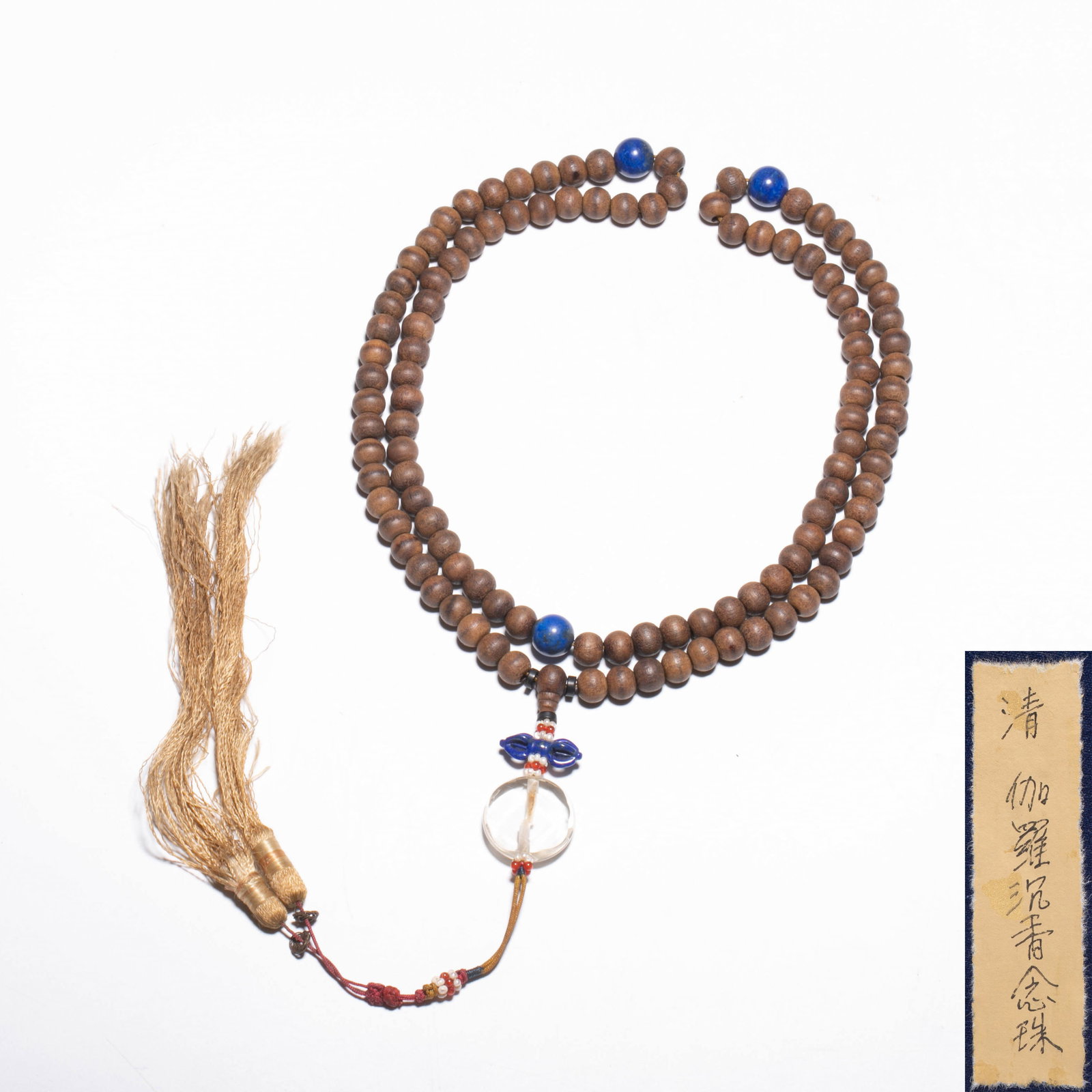 Qing Dynasty Jia Luo Agarwood Rosary Beads: This string is a Qing dynasty style Jialuo agarwood rosary. The beads have a dark brown wood tone, are oily and steady, have a fine and natural texture, are polished and mature, and feel warm when tou