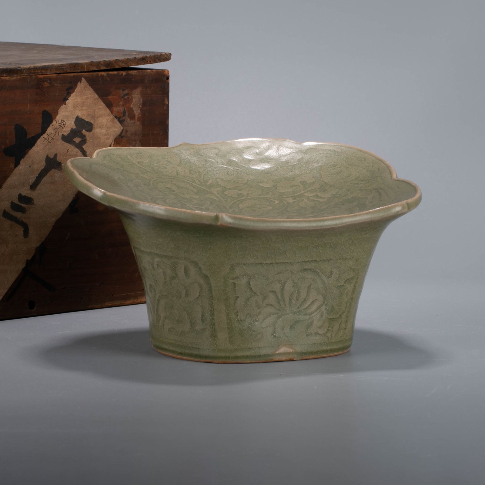 Jin Dynasty Yaozhou ware pillow with scrolling grass motif: Jin Dynasty Yaozhou ware pillow with scrolling grass motif