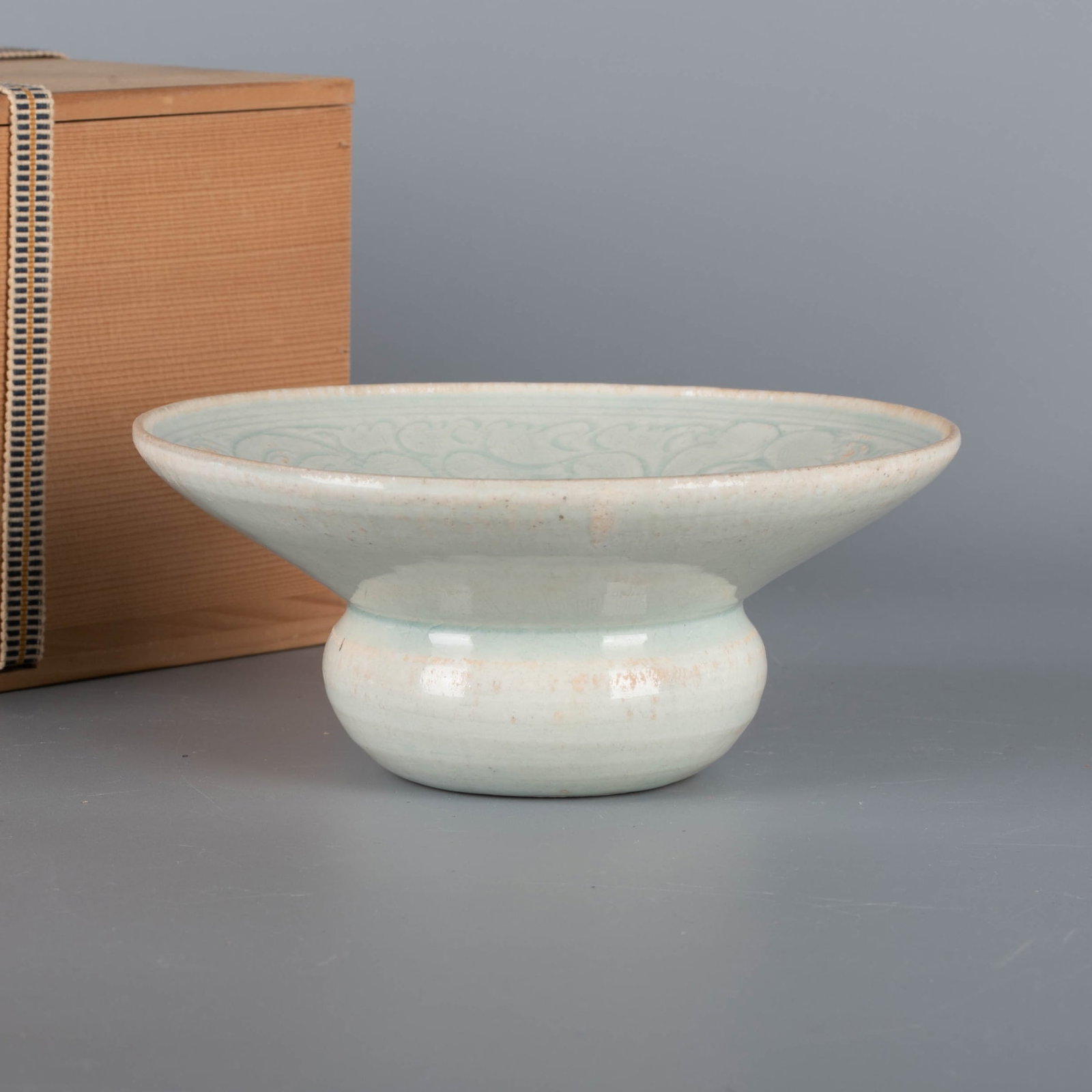 Song Dynasty Yingqing slop bowl with carved panzhi and child motif: Song Dynasty Yingqing slop bowl with carved panzhi and child motif