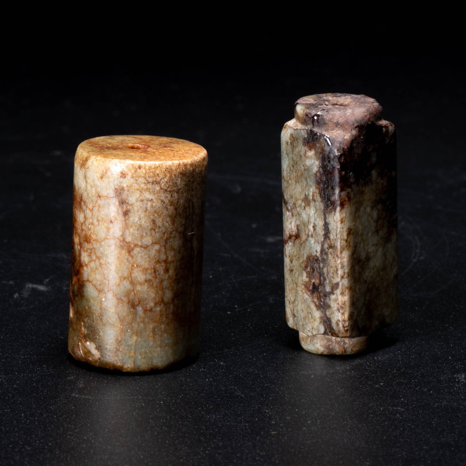 Ming Dynasty jade bead, 2 pieces: These two pieces are of the Ming dynasty style jade bead, one round and one square (the square one has steps and a tenon-like outline). They are both in the shape of a column with holes in the