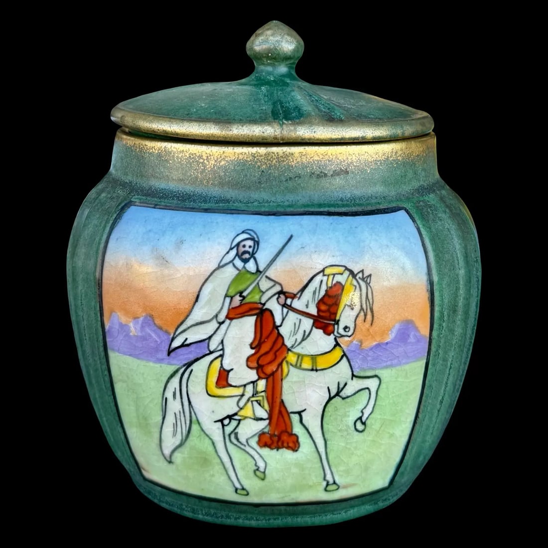 Teplitz Austrian Amphora Humidor: Teplitz Austrian Amphora Humidor A Teplitz art pottery covered jar, made by Riessner, Stellmacher & Kessel (RStK/Amphora). Green matte base featuring an orientalist scene depicting an Arabian
