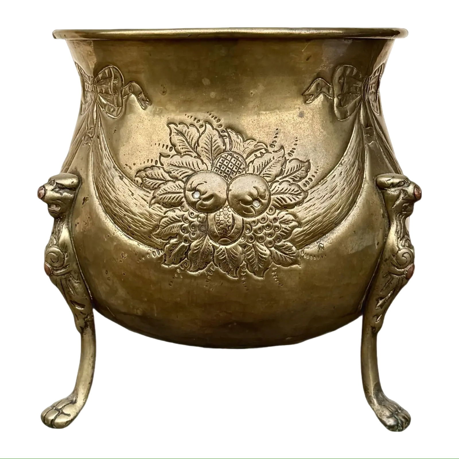 Repoussé Brass Floral Jardinière: Repoussé Brass Floral Jardinière An antique brass jardinière with repoussé decoration and lion monopod legs, late 19th century. Rounded brass body with raised fruit-and-foliage motifs and