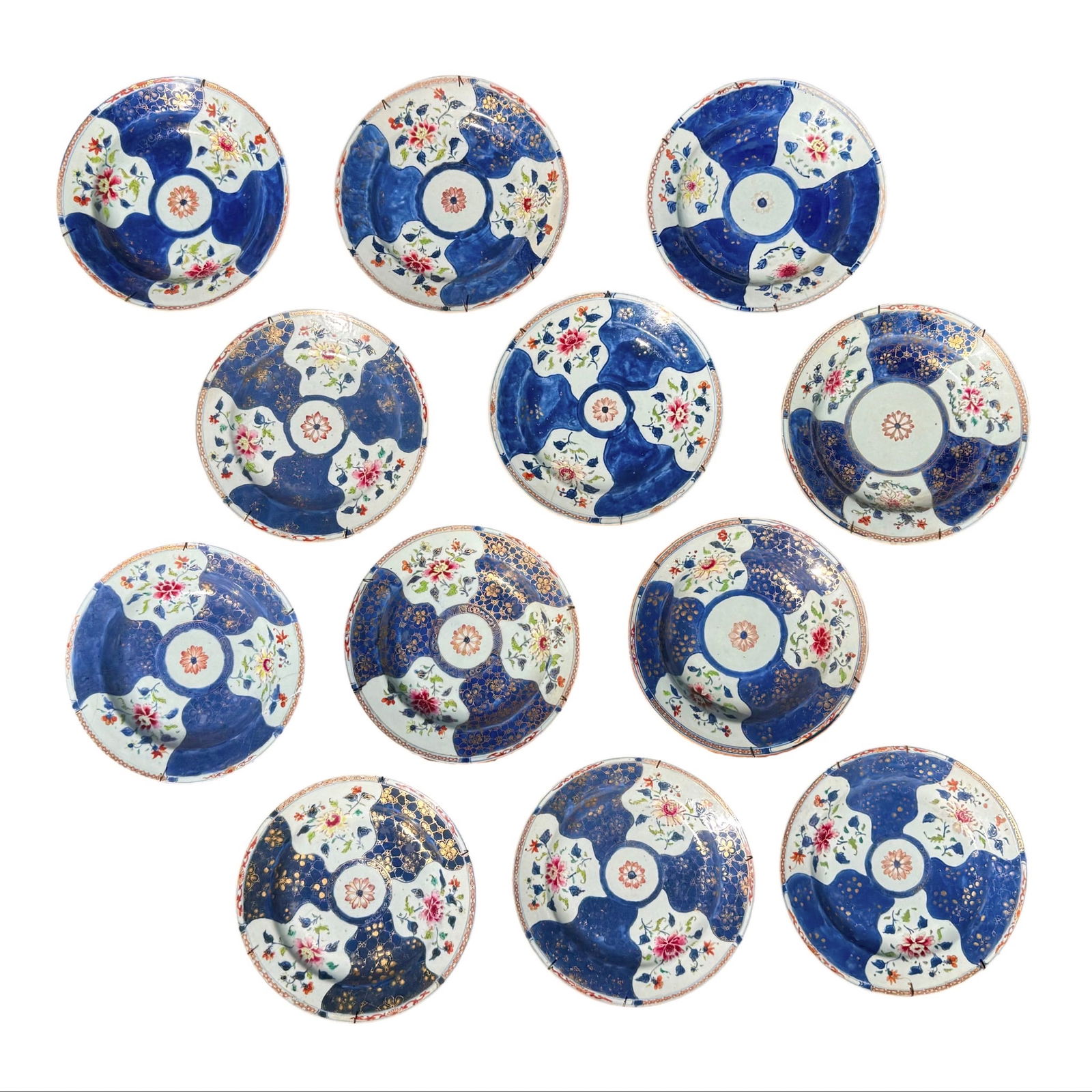 Queen Charlotte Imari Chinese Export Set: Set of 12 Chinese Export Queen Charlotte porcelain plates and bowls in Imari style with famille rose panels and powder blue ground, Qing Dynasty Yongzheng to early Qianlong period. Antique 18th centur