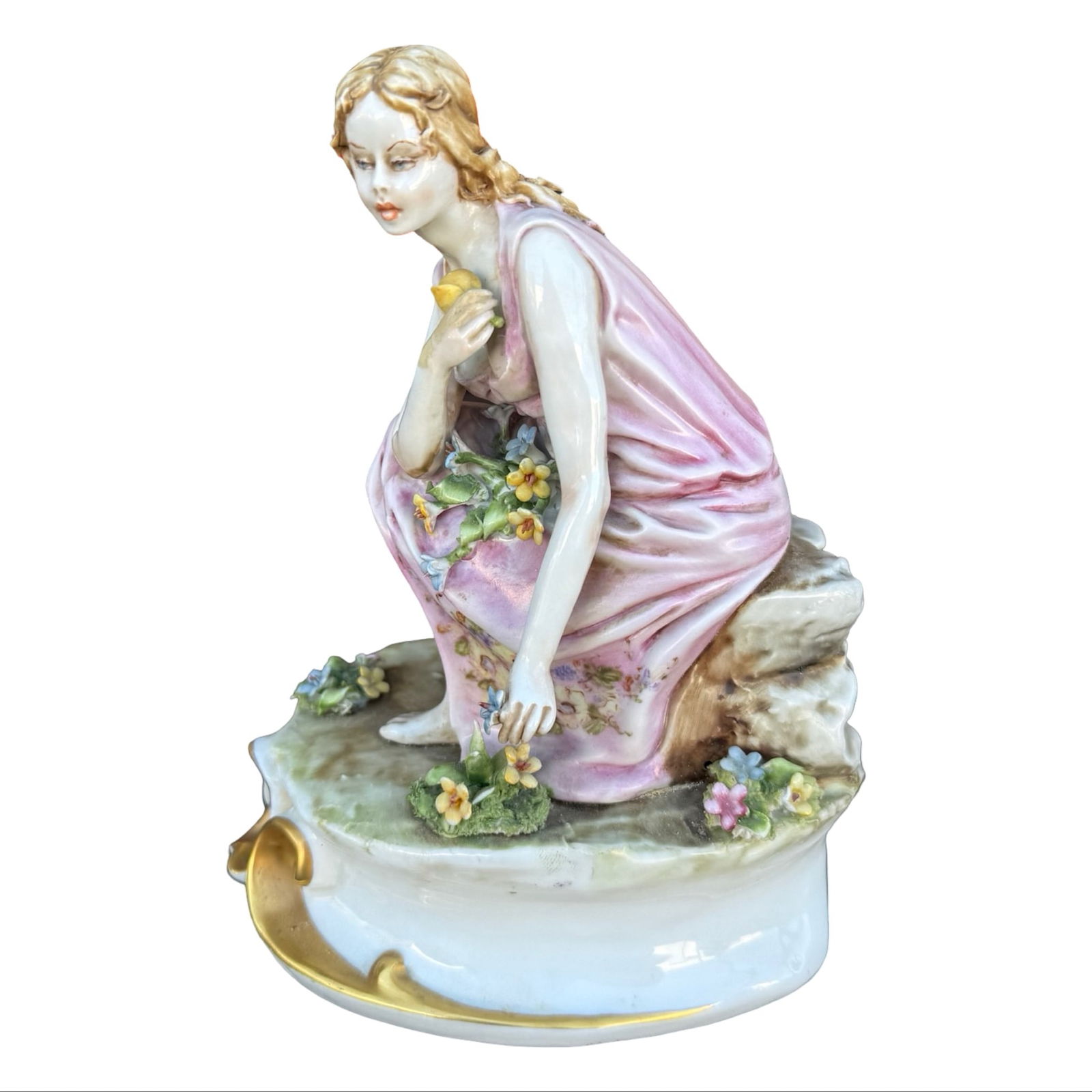 Italian Alparone Capodimonte Figure: Capodimonte porcelain female figurine with flowers by Mario Alparone, signed on the side with crowned N mark on the back. Dimensions: 7H x 3.5W x 5D inches