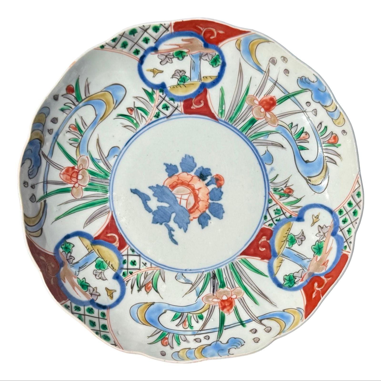 Japanese Meji Imari Porcelain Plate: Antique Japanese Imari porcelain plate attributed to the 19th century Meiji period with cobalt blue underglaze and iron red enamel decoration. Hand-painted Arita ware plate with scalloped rim and trad