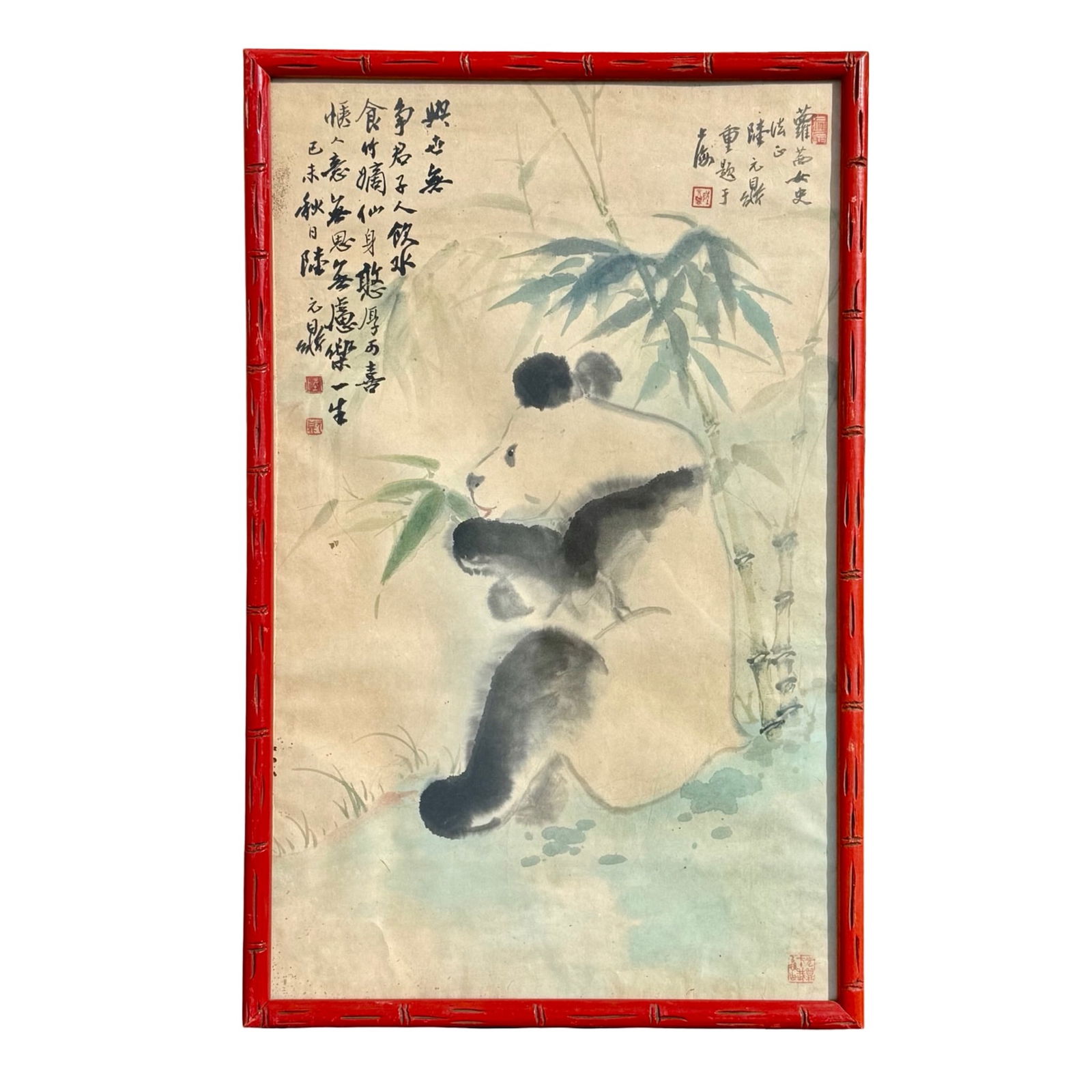 Chinese Panda Watercolor Painting: Watercolor painitng of a panda eating bamboo in the style of Wu Zoren, set in a red faux-bamboo frame. Dimensions: 27H x 17W x 1.5D inches