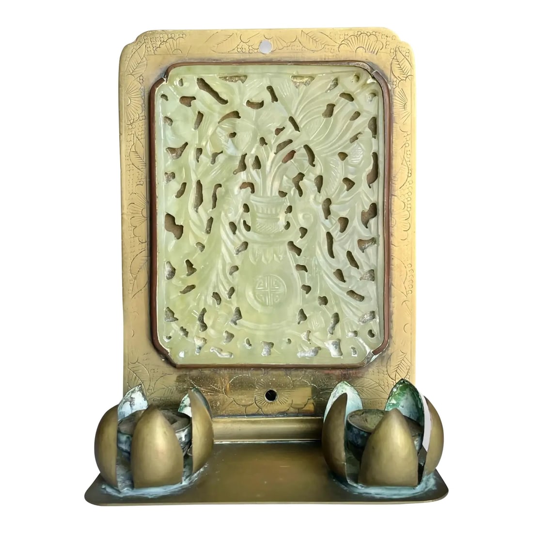 Chinese Jade Brass Candle Holder: This antique Chinese wall-mounted candlestick holder dates to the early 20th century and features an intricately carved jade plaque set within a hand-etched brass frame. Dimensions: 7H x 4.75W x 2.5D