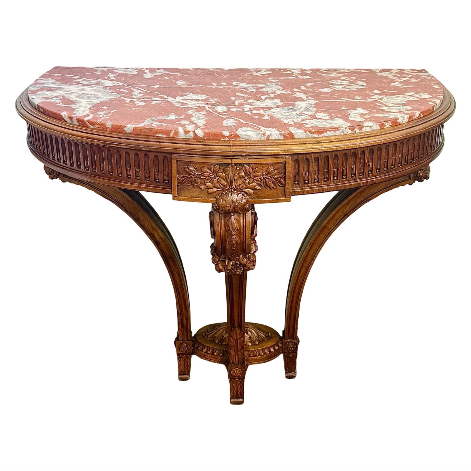Louis XVI Demilune Marble Table: Neoclassical half-moon carved wood table with fluted frieze and cabriole legs. Features solid variegated marble top in pink, white, and gray tones. Dimensions: 35.5H x 39W x 22D inches