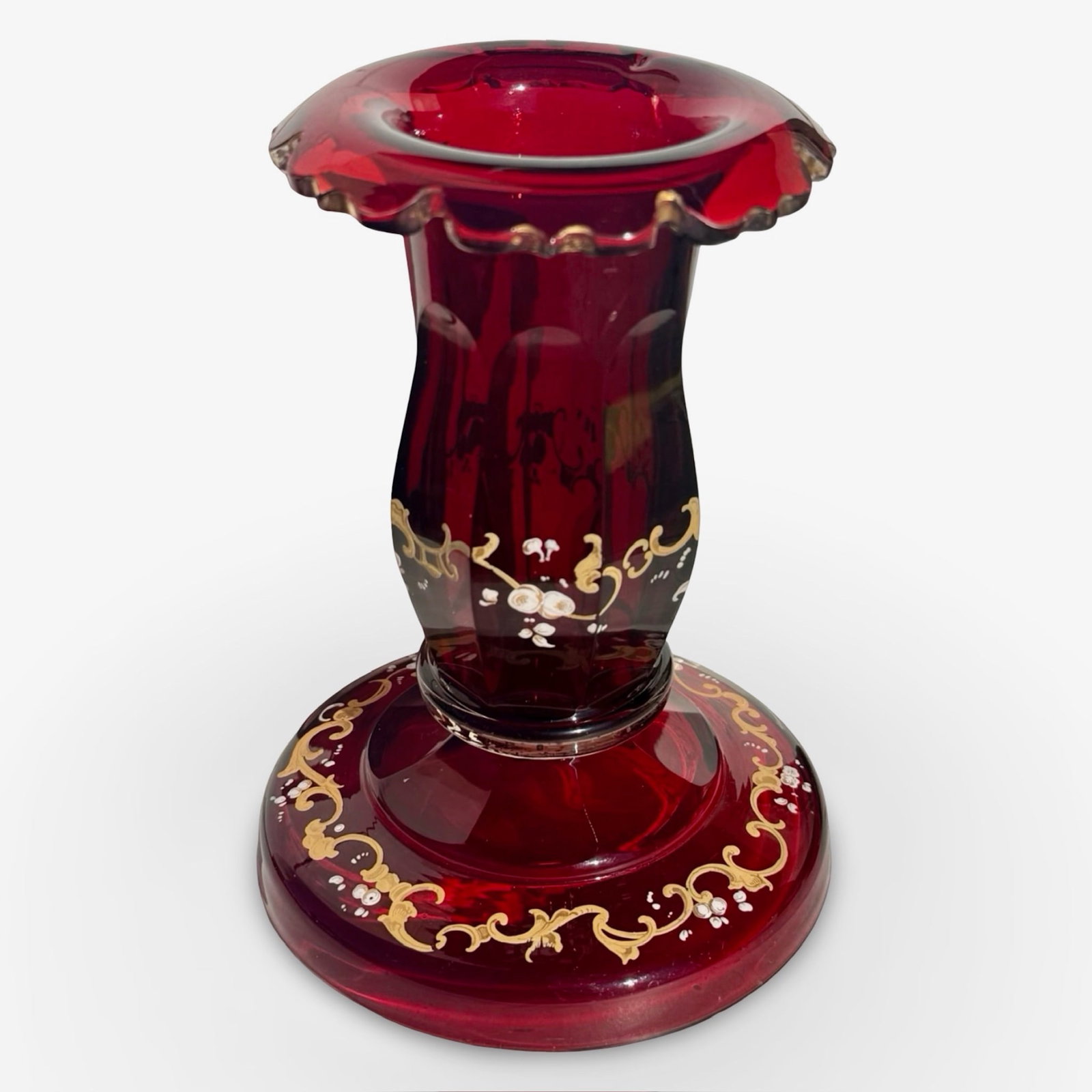 Bohemian Ruby Glass Candlestick: Bohemian ruby red cranberry glass candlestick with painted floral decoration. Approx. Dimensions: H x W x D inches