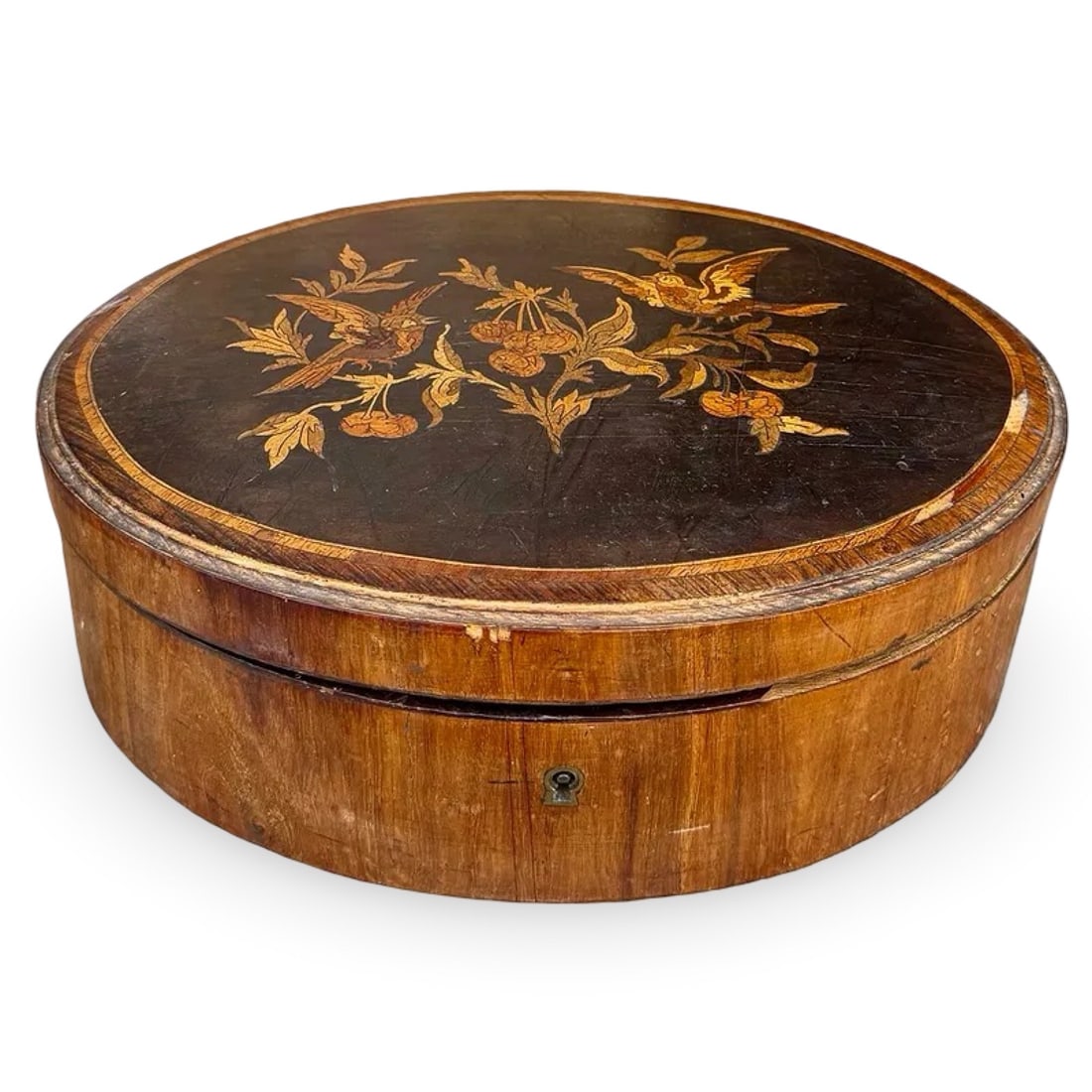 French Marquetry Inlaid Box: Antique French Louis XVI wooden marquetry box with inlaid bird surrounded by foliage and fruit on the lid. Interior is lined. Approx. Dimensions: 4.25H x 12W x 8.75D inches