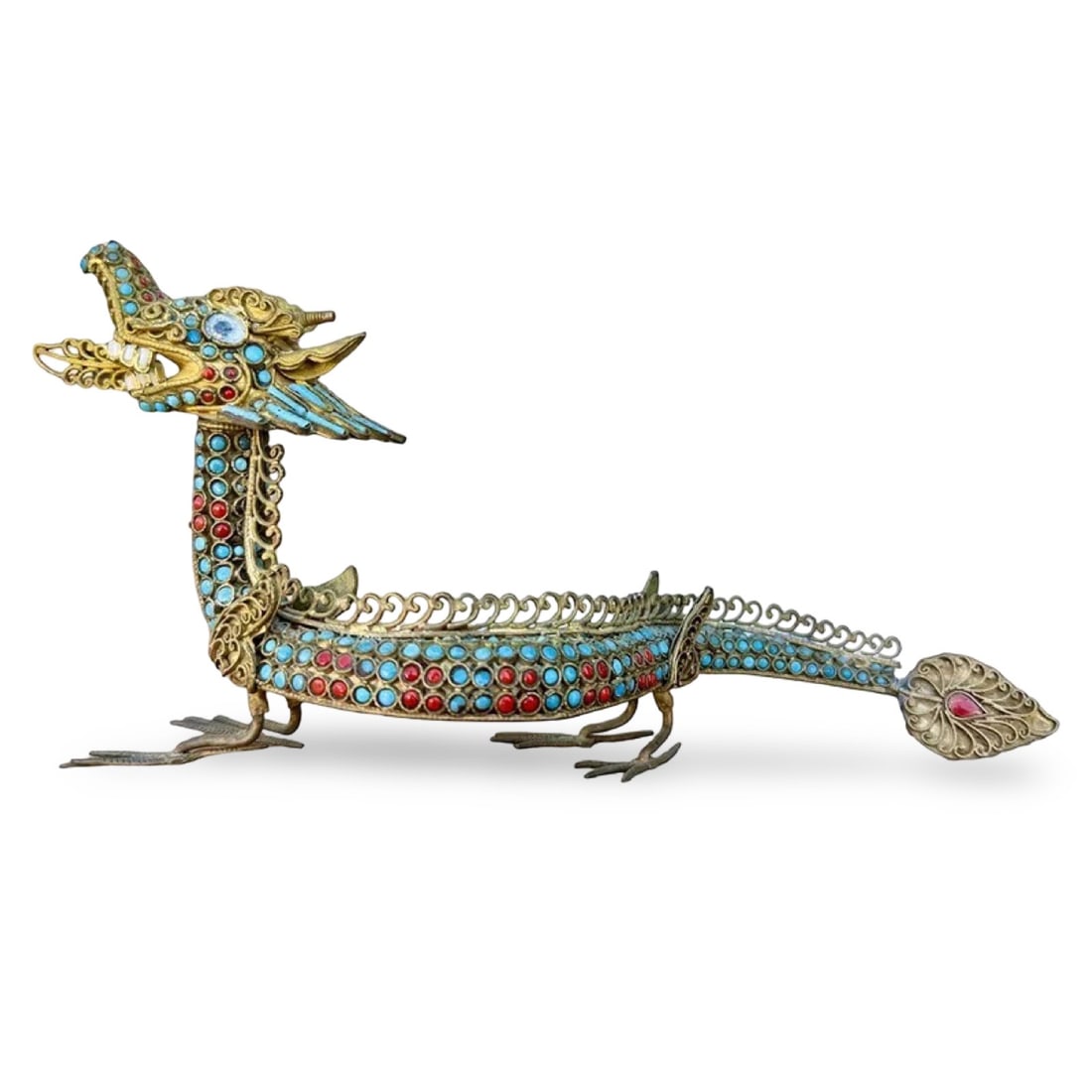 Chinese Filigree Dragon Figure: Metal filigree jeweled dragon sculpture inlaid with turquoise and coral stones. Head is removable. Dimensions: 4H x 8W x 2D inches