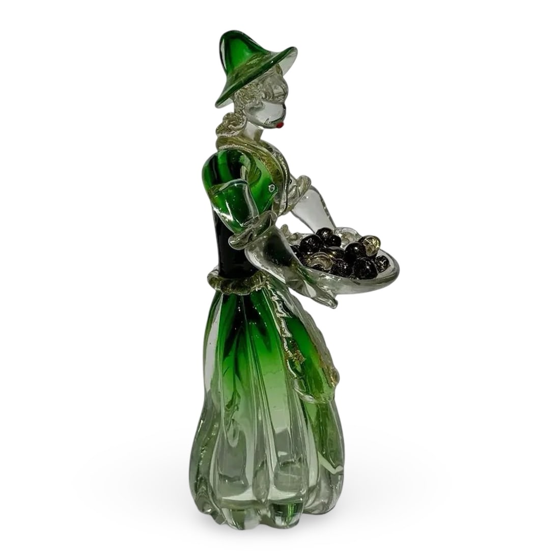 Italian Murano Glass Lady Figurine: Italian Murano-attributed glass lady peasant figurind. Hand-blown mid-century Venetian green art glass. Approx. Dimensions: 5W × 5D × 11H inches
