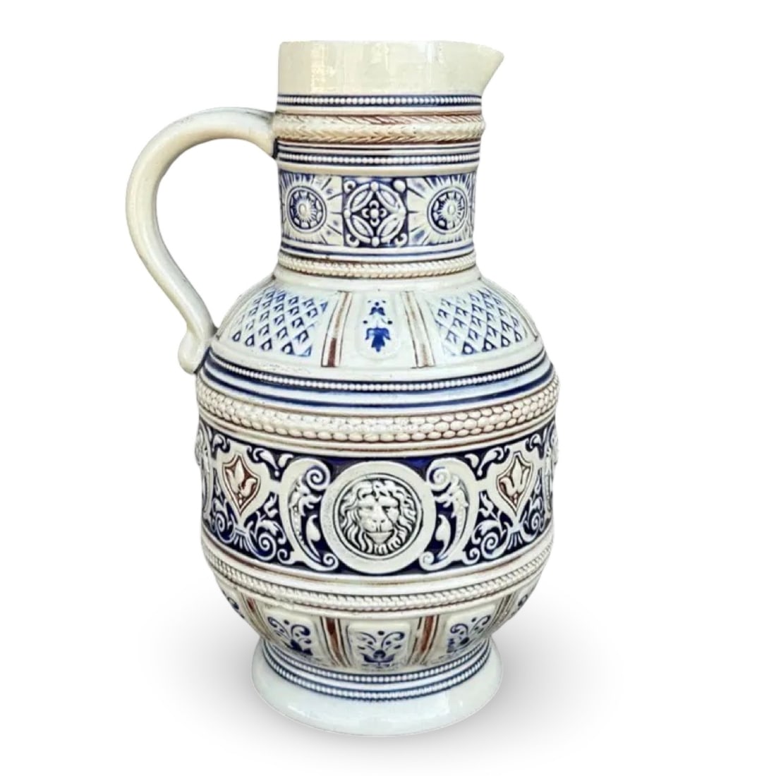 Marzi Remy Lion Salt Glaze Pitcher: German Marzi & Remy salt-glazed stoneware pitcher with lion head medallion. Marked on base. Approx. Dimensions: 6.5W × 5D × 9H inches