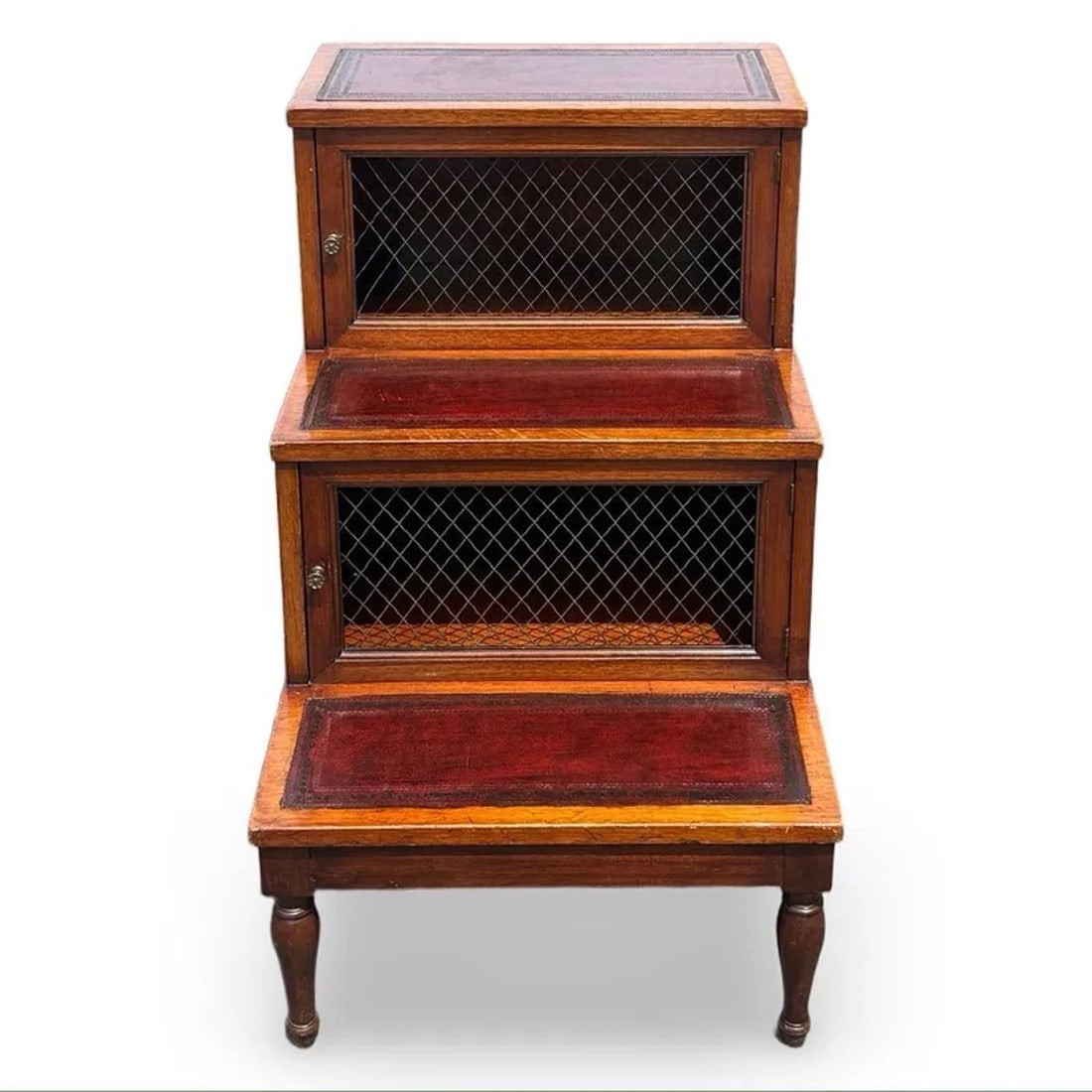 Library Step Cabinet Stool: Antique tiered wooden library step cabinet or stool with storage compartments and mesh-front doors. Approx. Dimensions: 27.5H x 18W x 23D inches