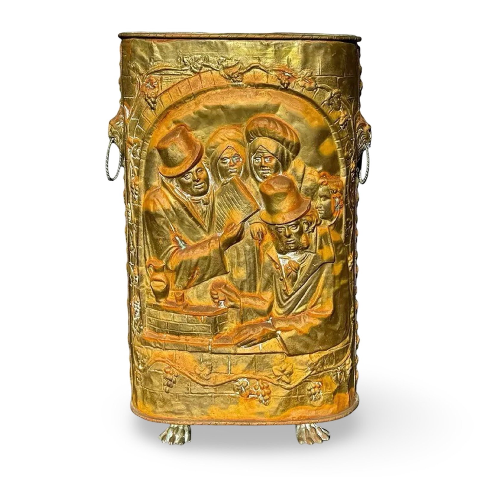 Victorian Repoussé Umbrella Stand: Victorian Repoussé Umbrella Stand Antique Victorian-attributed embossed metal umbrella stand with repoussé relief, lion-head ring handles, and claw feet. Approx. Dimensions: 17W × 9.75D × 26.5H in