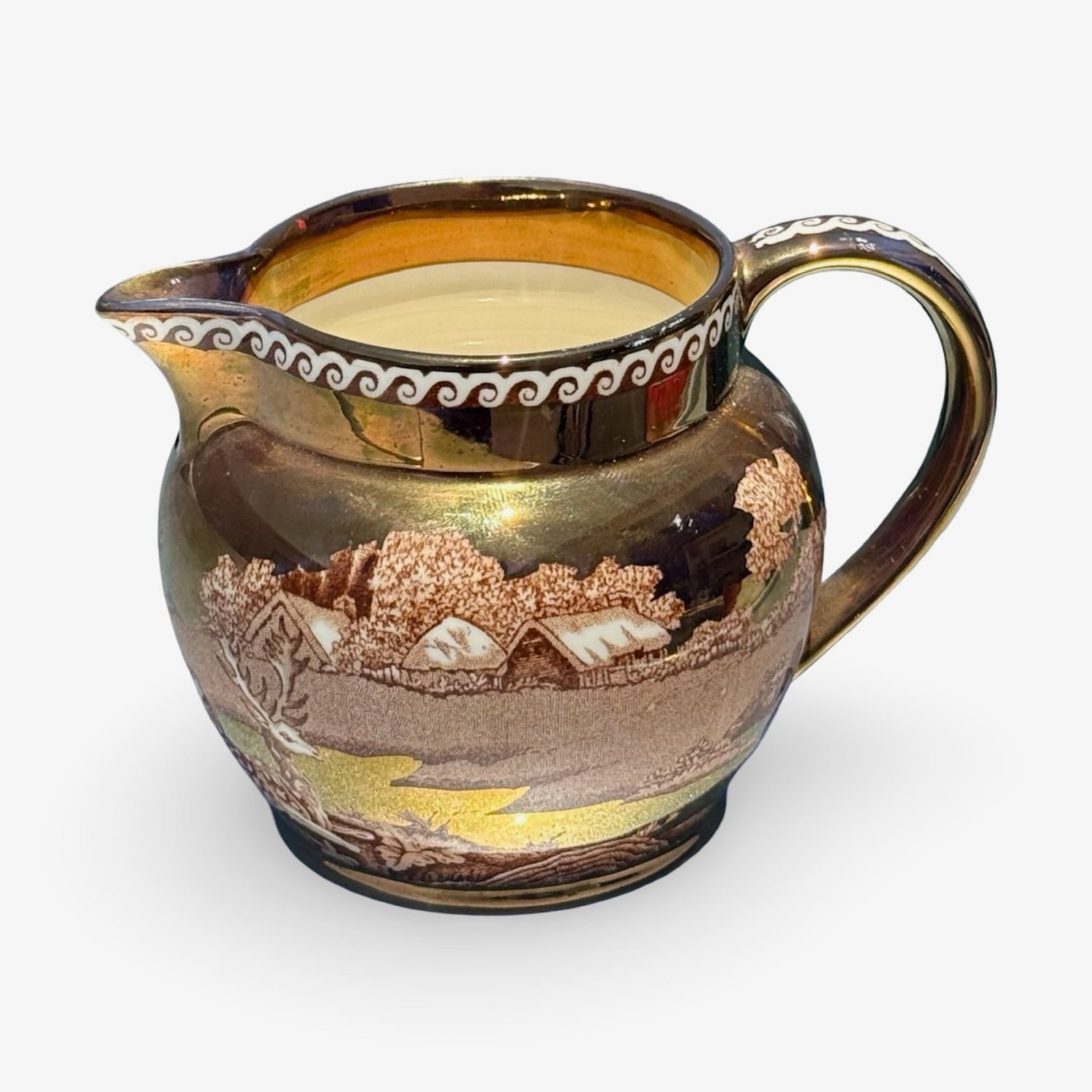 Wedgwood Lusterware Creamer Pitcher: Vintage English Wedgwood "Fallow Deer" copper lusterware creamer pitcher with a metallic copper glaze. Marked on base.