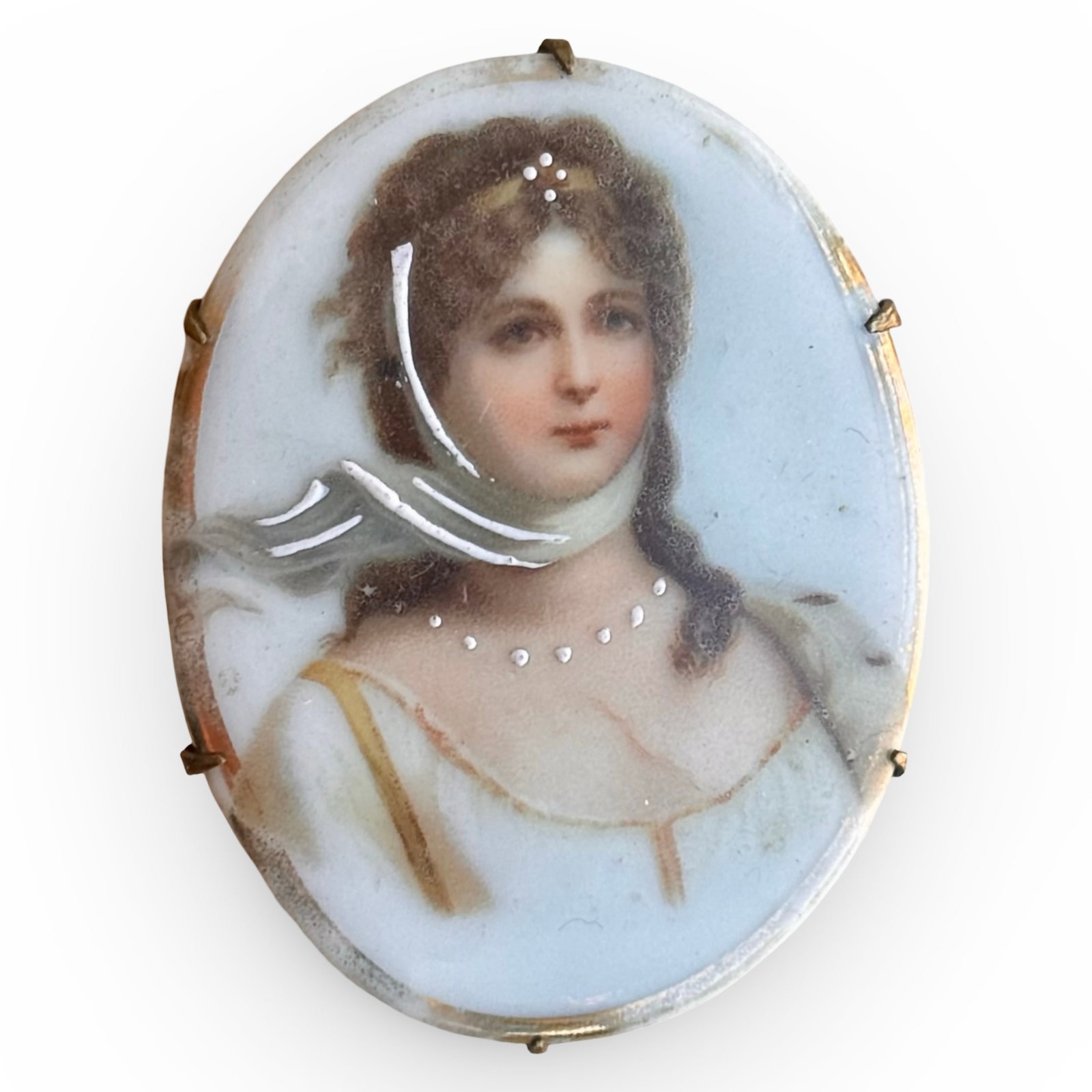 Victorian Queen Louise Brooch: Antique Victorian porcelain portrait brooch of Queen Louise of Prussia, after the Gustav Richter portrait. Set in a metal prong bezel. Approx. Dimensions: 2 H x 1.25 W x 0.25 D inches