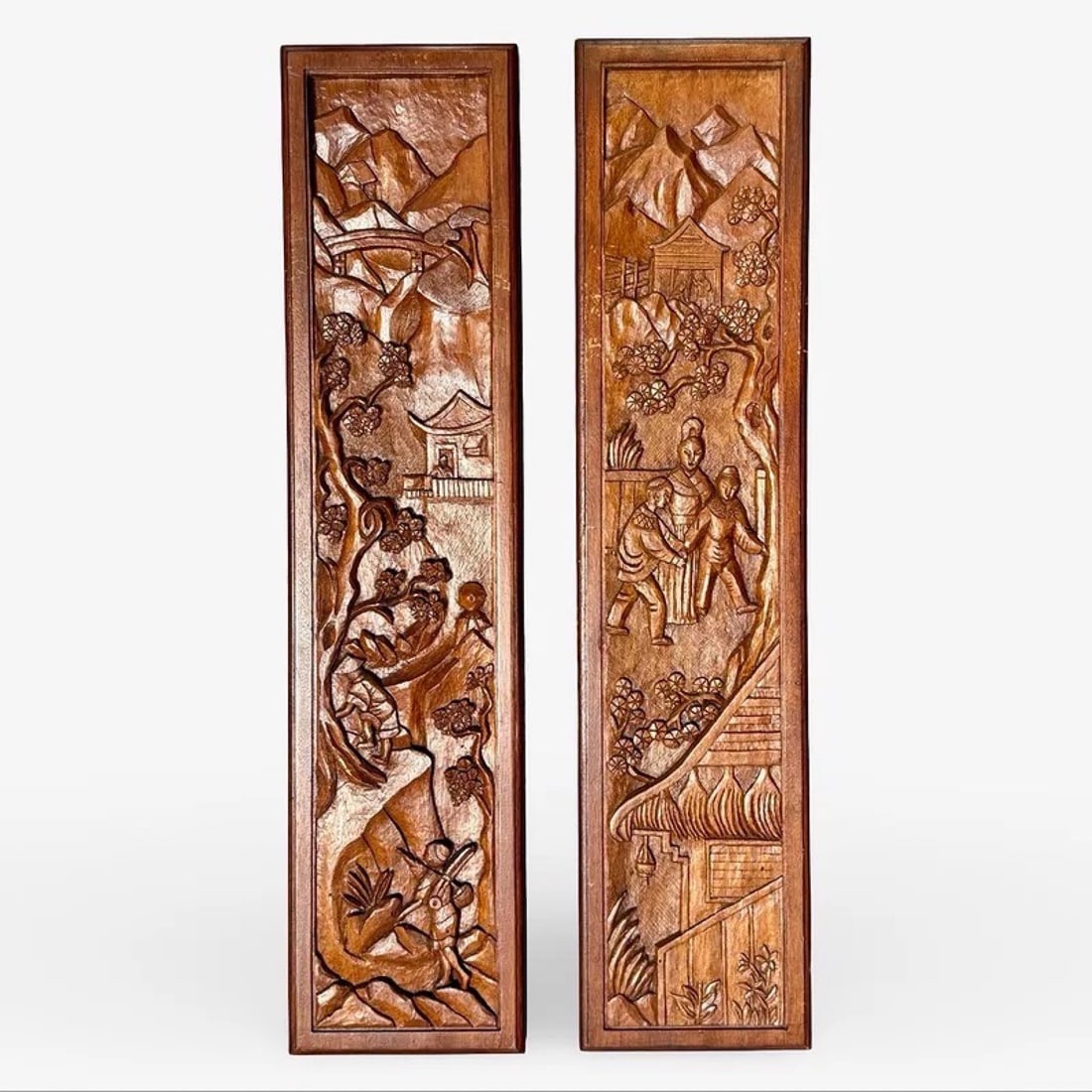 Carved Asian Wood Wall Panels: Pair of Asian hand-carved wooden wall panels with high-relief village and landscape scenes. Approx. Dimensions: 30H x 7.25W × 1D inches