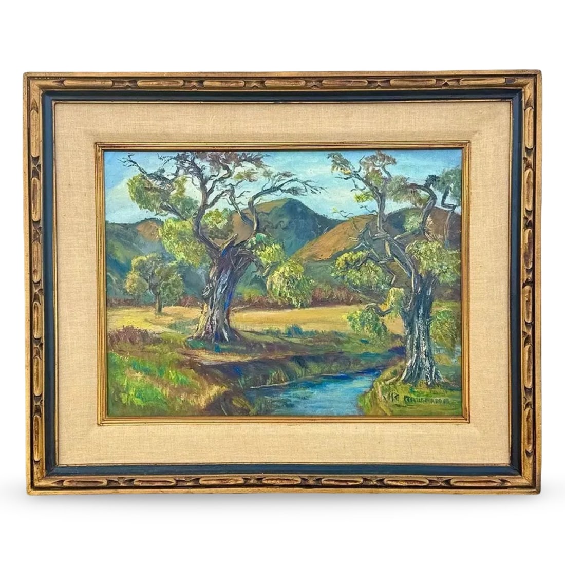 California Plein Air Landscape Painting: California Plein Air Landscape Painting An oil on canvas landscape in the California Impressionist style. Depicts trees along a stream within a rolling valley. Housed in a carved wood frame with fabri